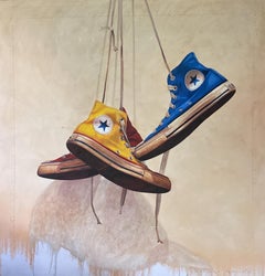 "#1597" blue, red and yellow converse hang from above