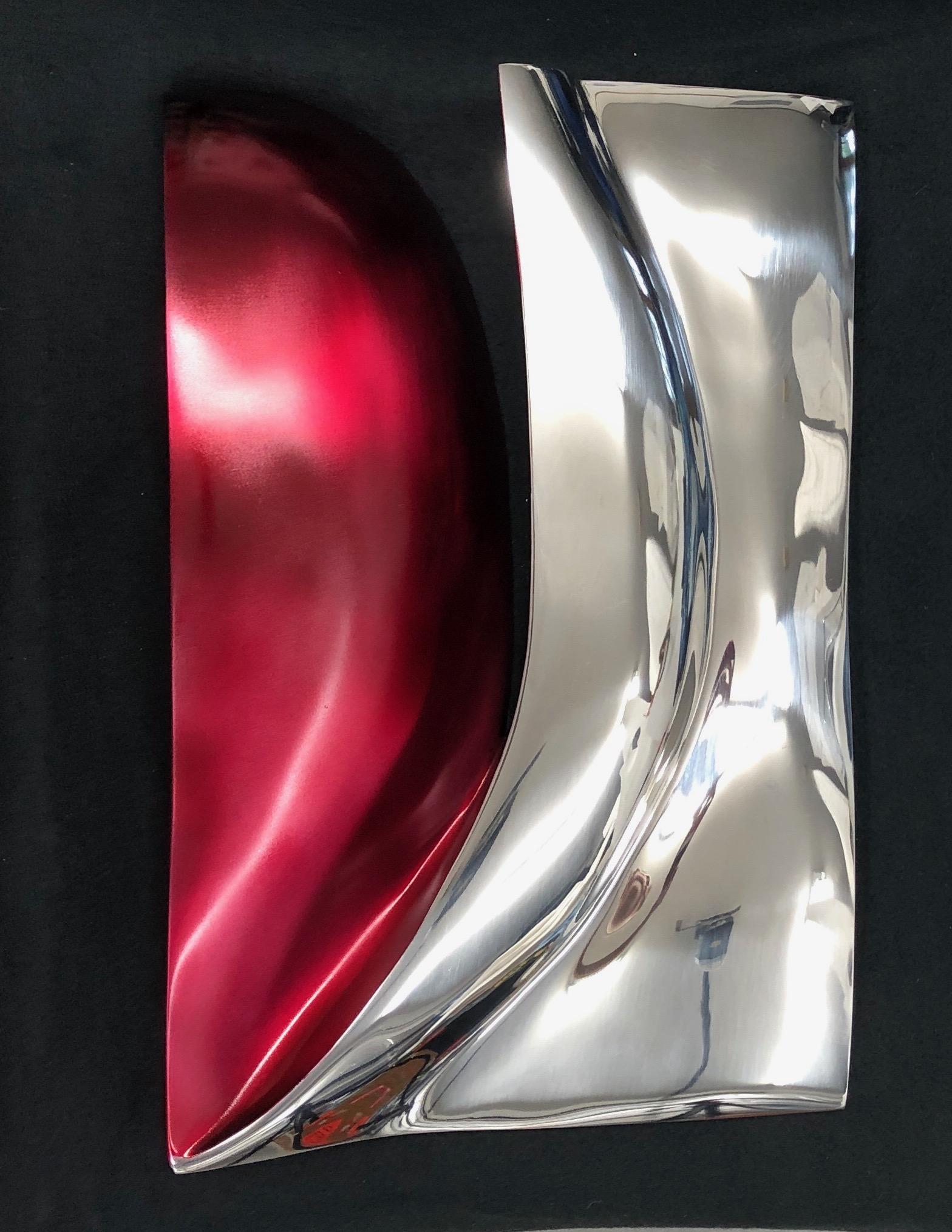 Italian stainless steel with red tint.

Sculptor Santiago Medina Italian stainless steel sculptures are at marquee public art venues worldwide such as Harvard, Stanford University, City of Miami-Pinecrest Circle, Tufts, Washington University,
