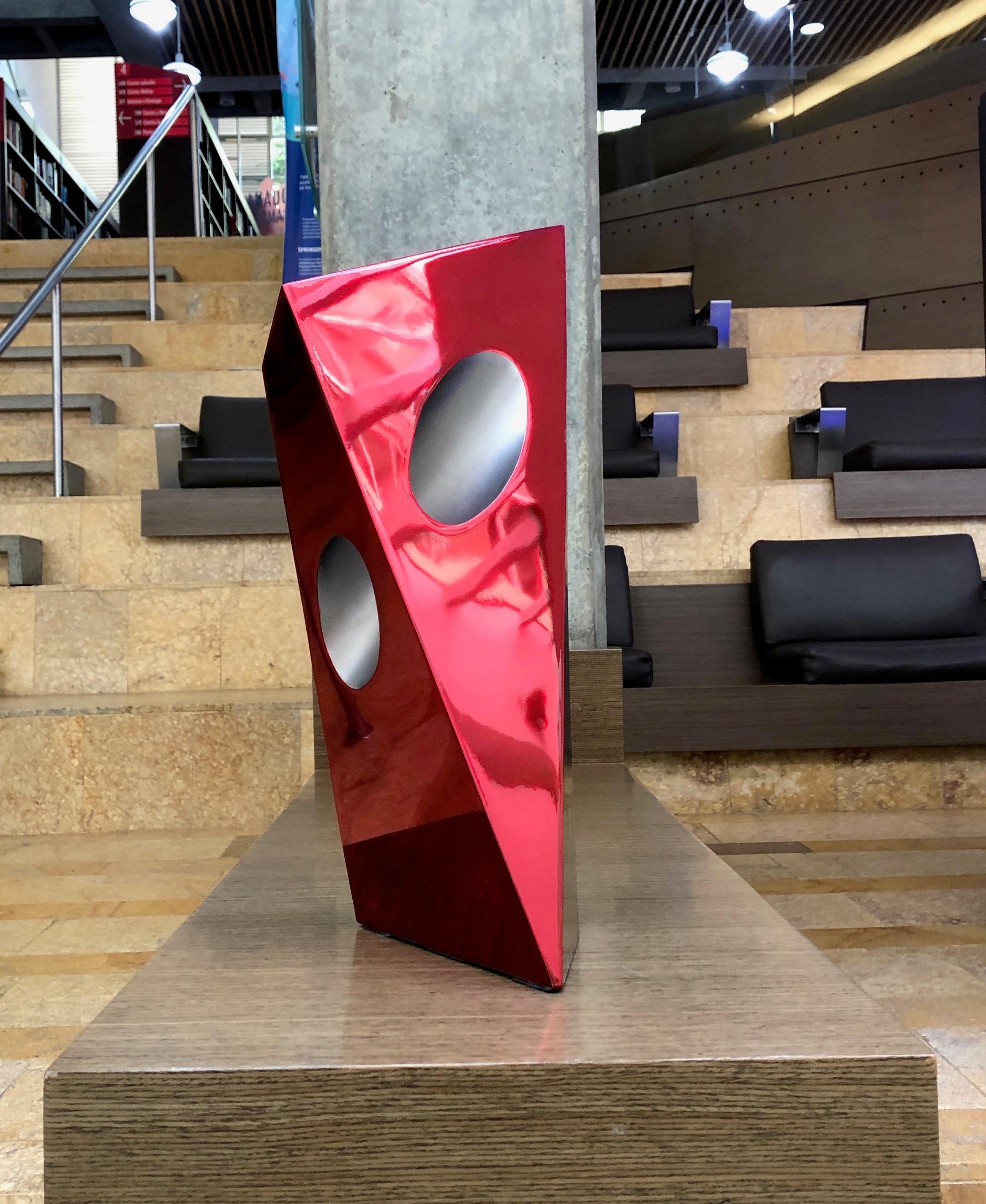 Italian stainless steel with red tinting. 

This sculpture will be shipped directly from the artist's studio.