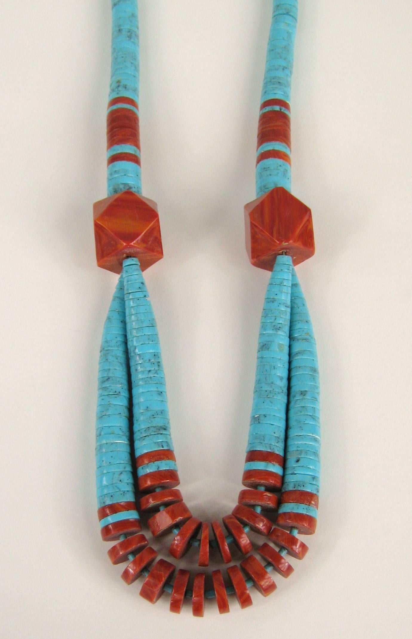 Double strand at the bottom on this statement Necklace. Large Turquoise discs graduating in size from 14. mm down to 7.75mm. Huge 25mm Spiny Oyster beads accent the turquoise. This large, bold and dramatic necklace from Santo Domingo Pueblo in New