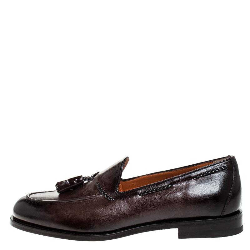 Santoni brings you these grand loafers that have been created with luxury in mind. They are covered in brown leather and detailed with tassels on the uppers and soft leather insoles meant to offer comfort in every step. The loafers are a result of