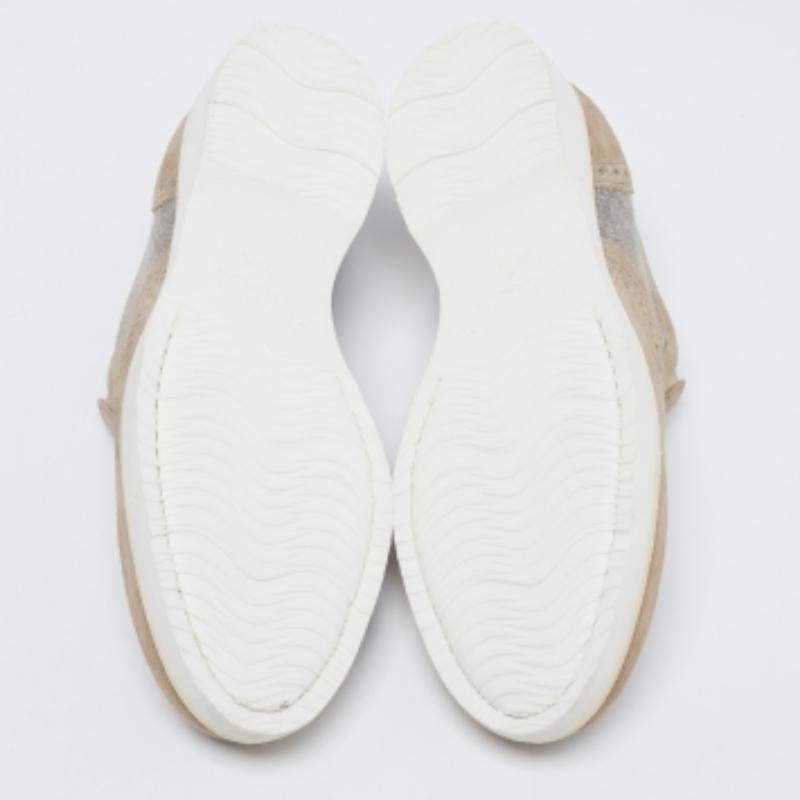 Beautifully crafted using suede and canvas, these Santoni slip-on sneakers are sure to keep you comfortably stylish. Featuring elastic panels, brogue details, and flexible rubber soles, these shoes will be a great addition to your closet.