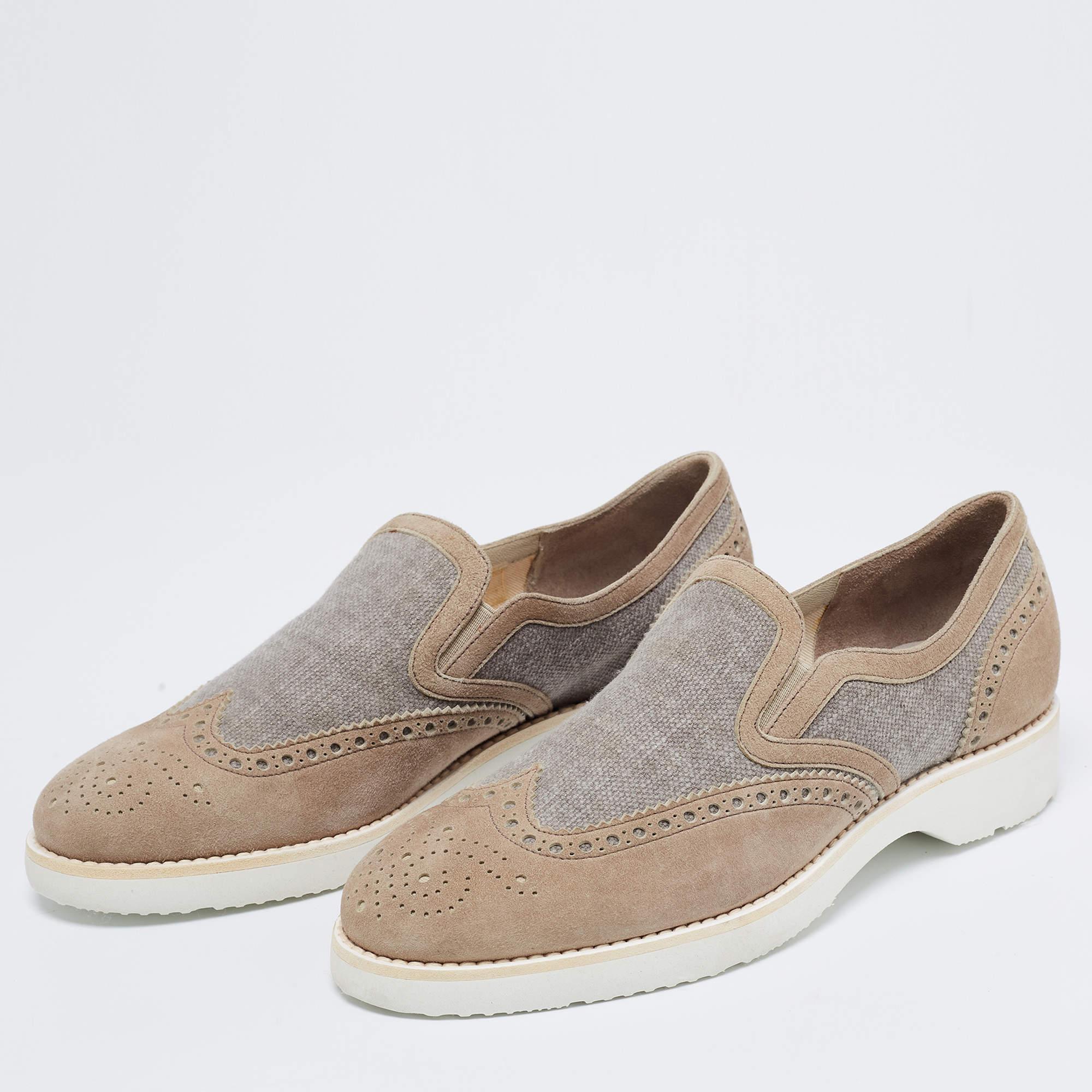 Beautifully crafted using suede and canvas, these Santoni slip-on sneakers are sure to keep you comfortably stylish. Featuring elastic panels, brogue details, and flexible rubber soles, these shoes will be a great addition to your closet.

