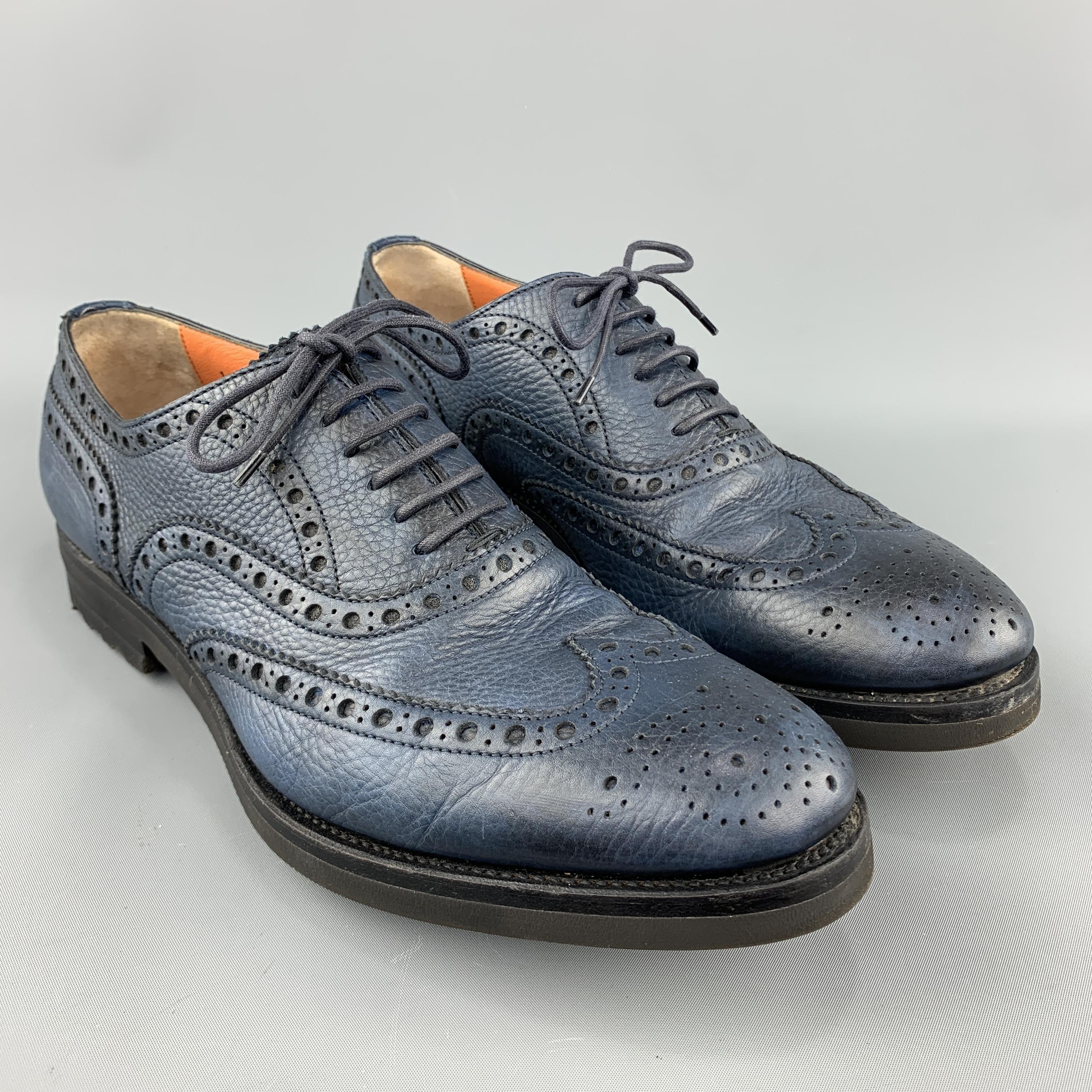 SANTONI dress shoes come in navy blue pebbled leather with a medallion wingtip brogueing throughout, and rubber track sole. Made in Italy.
 
Excellent Pre-Owned Condition.
Marked: IT 45
 
Outsole: 12.25 x 4.25 in.
