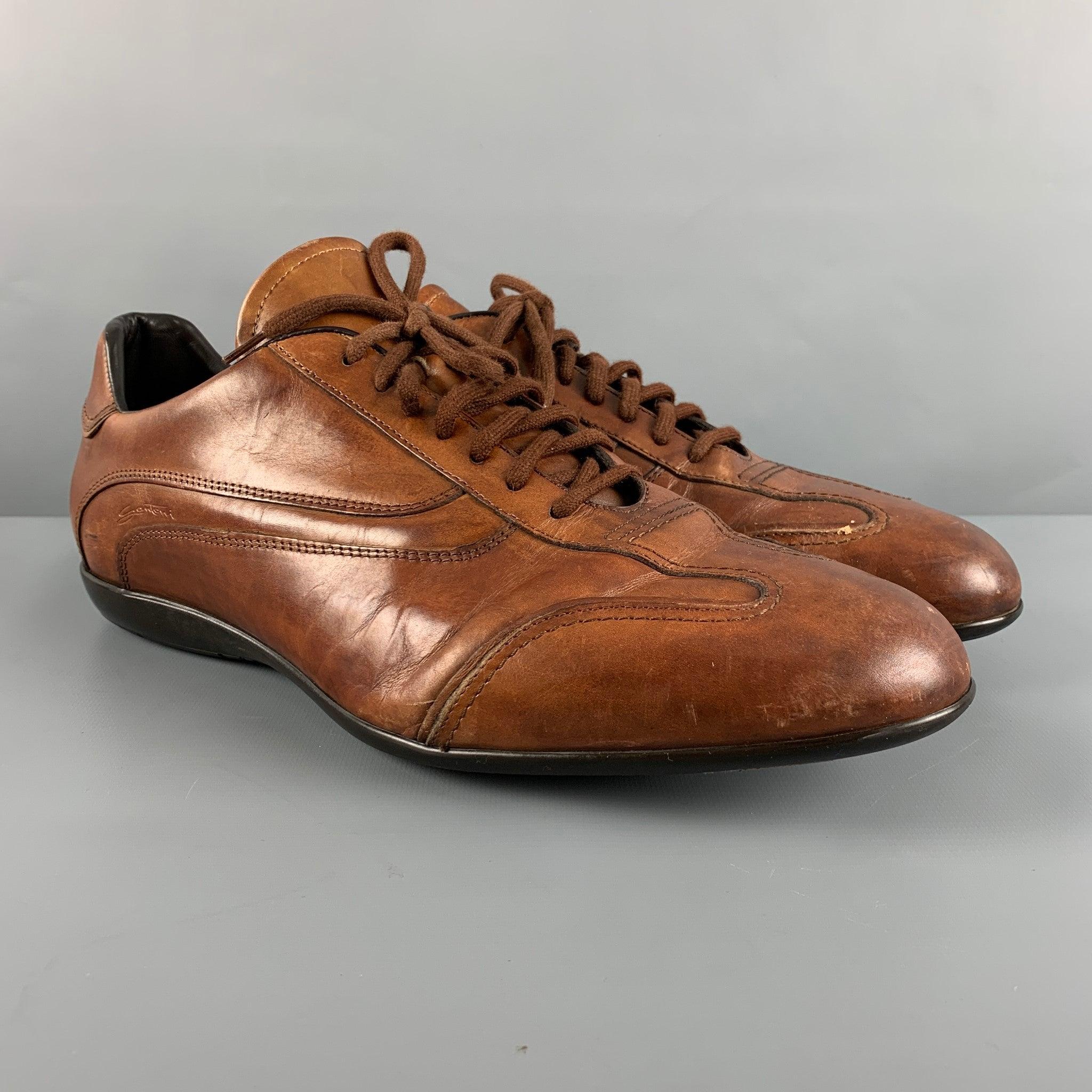 SANTONI sneakers comes in a brown leather featuring a low-top style and a lace up closure. Very Good Pre-Owned Condition. 

Marked:   D13Outsole: 13 inches  x 4.25 inches  
  
  
 
Reference: 126773
Category: Sneakers
More Details
    
Brand: 
