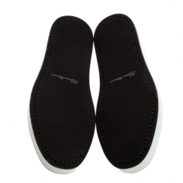Let your latest shoe addition be this pair of white sneakers from Santoni. They've been crafted from perforated leather and styled with lace-ups and simple round toes. They are complete with contrast leather tabs on the counters and rubber soles.