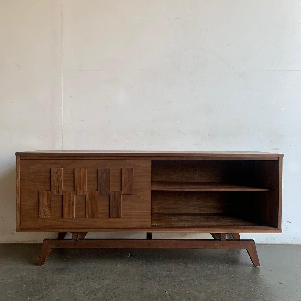 Handcrafted and made in house by Vintage On Point. Item offers solid and veneered walnut with sculpted walnut rectangles that both add design flare and work as handles. Item sits on a sculpted angled base with ample support cross bars. This is a