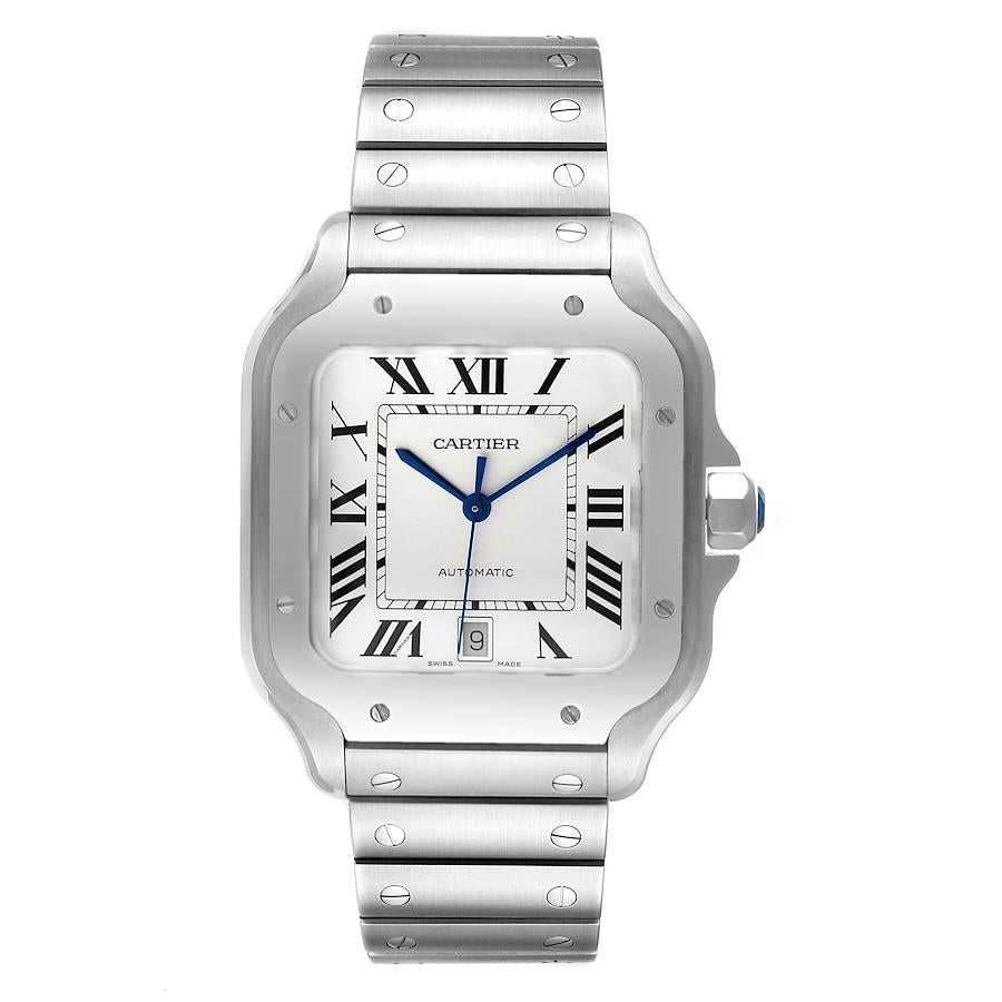 Santos de Cartier Silver Dial Large Steel Mens Watch WSSA0018 Unworn. Automatic self-winding movement. Stainless steel case 39.8 x 47.5 mm. Octagonal crown set with the faceted blue spinel. Stainless steel bezel punctuated with 8 signature screws.