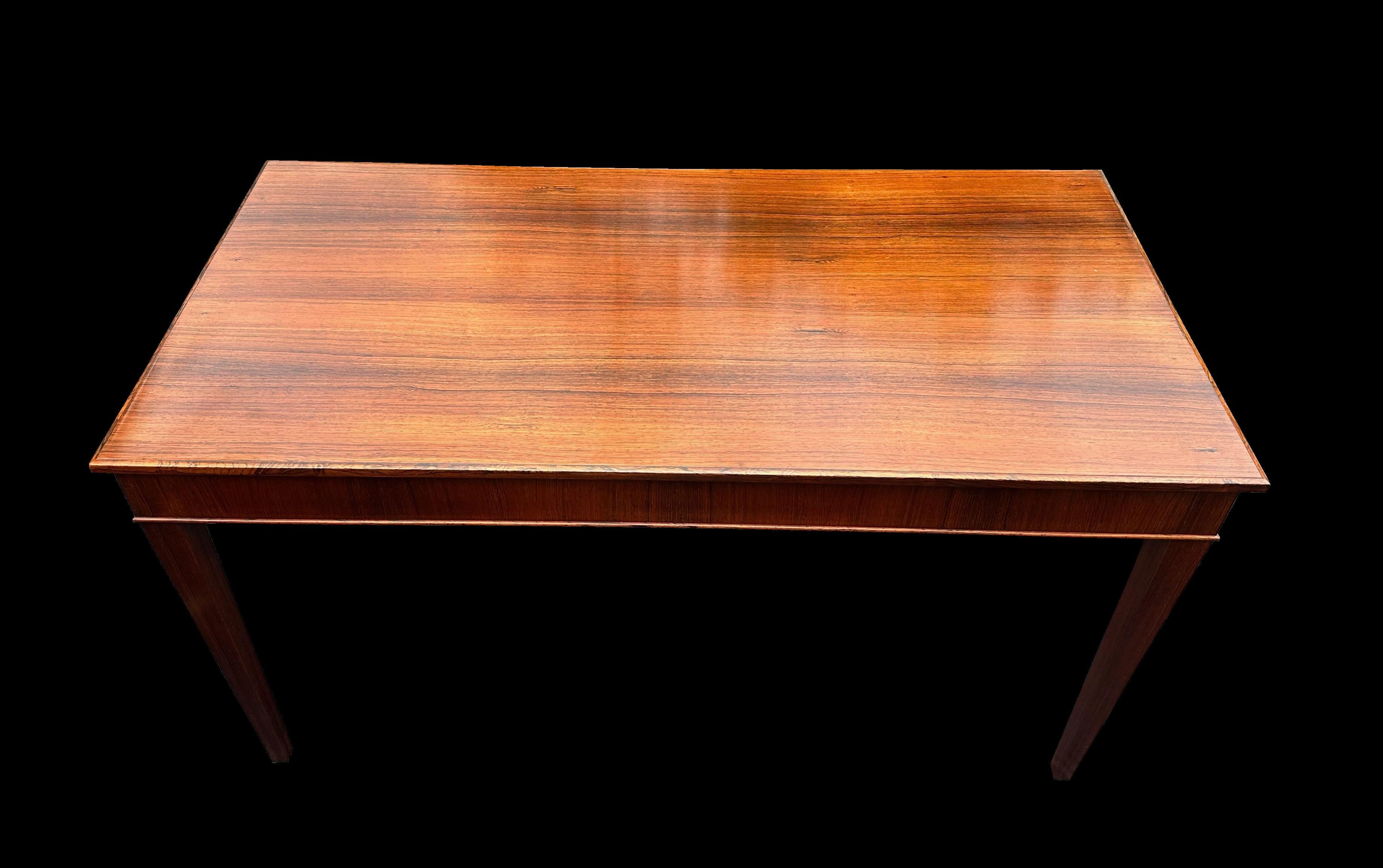This is a classic piece of early Scandinavian design, made from Santos Rosewood it's on the edge of the change between antique and mid-century and fits beautifully with both camps. Top quality and made by the cabinetmaker who also designed it.