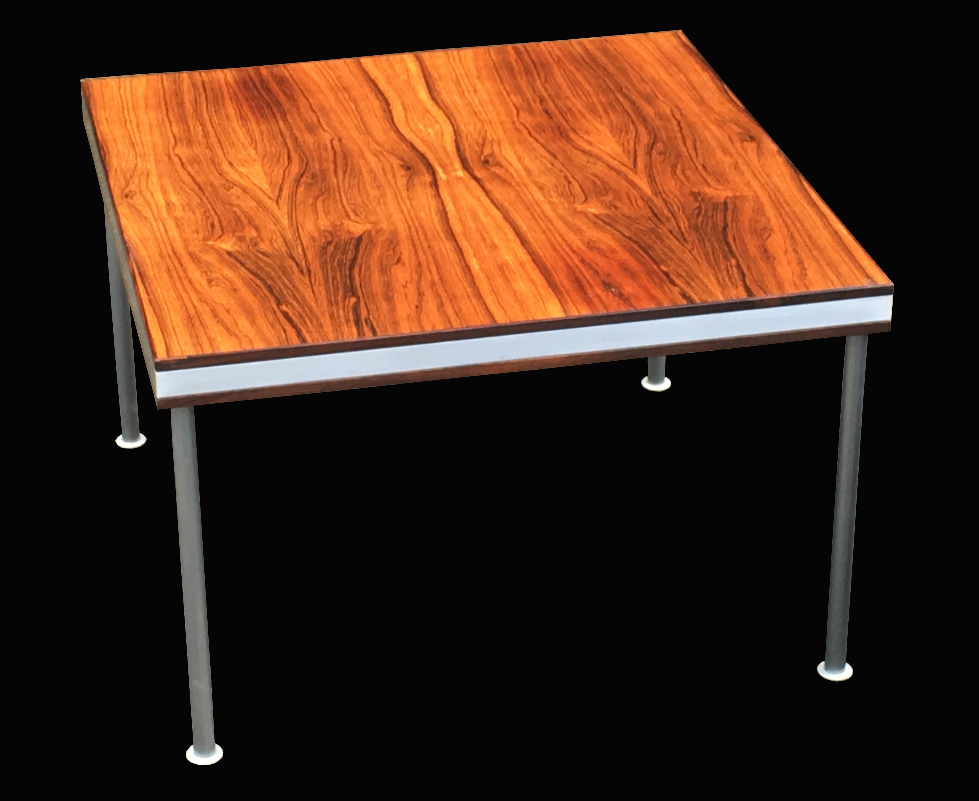 A very nice coffee table, sometimes by Poul Cadovious, the nicely figured Santos Rosewood ( a species which does not require CITES certification) with aluminium edges and legs. A very nice example in great condition and with an especially nice color