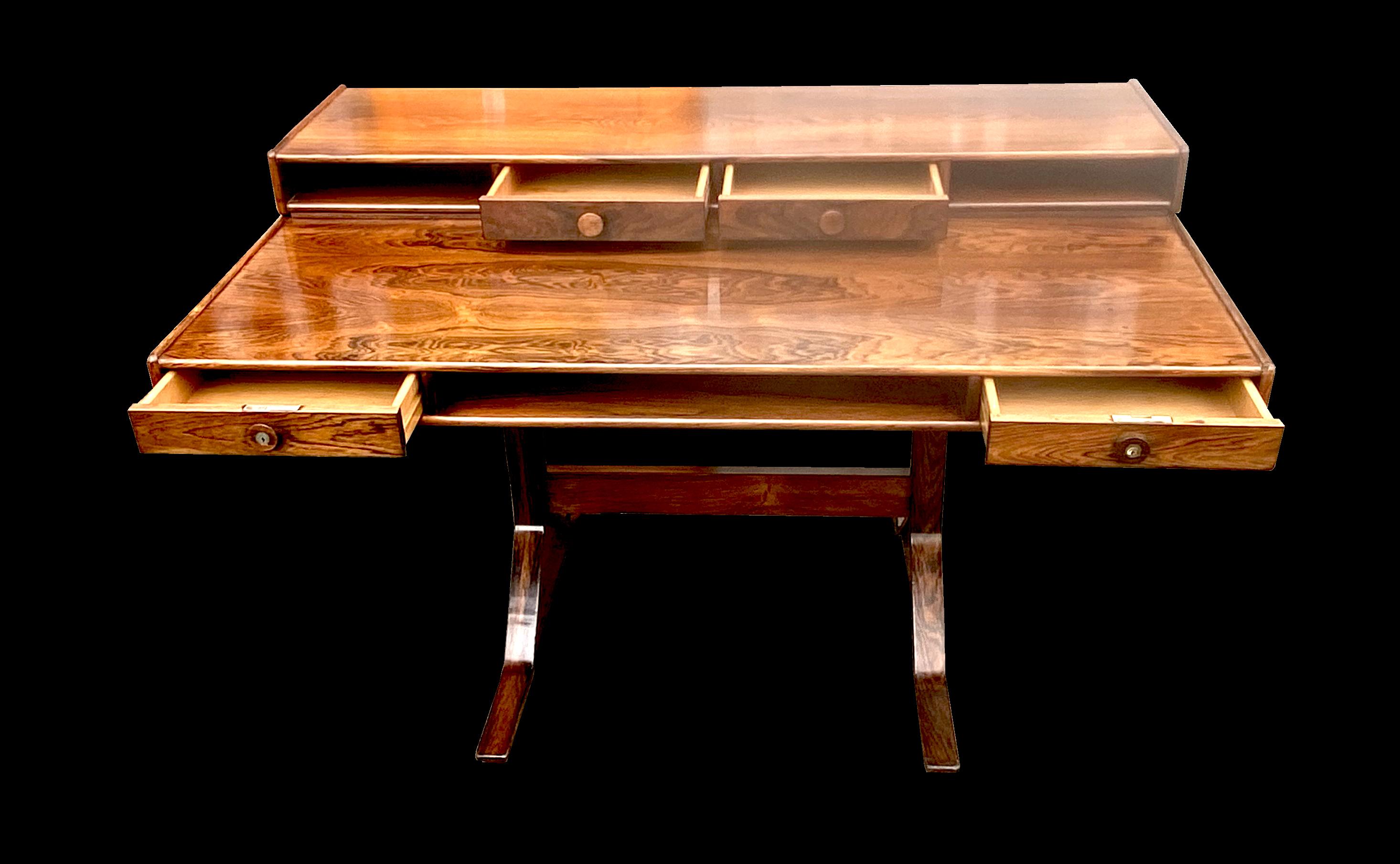 This is a fabulous example of this Italian mid century desk by Gianfranco Frattini and produced by Bernini, consisting of 2 drawers and a pigeon hole on the lower tier and 2 drawers and 2 pigeon holes on the top tier all of which is supported by