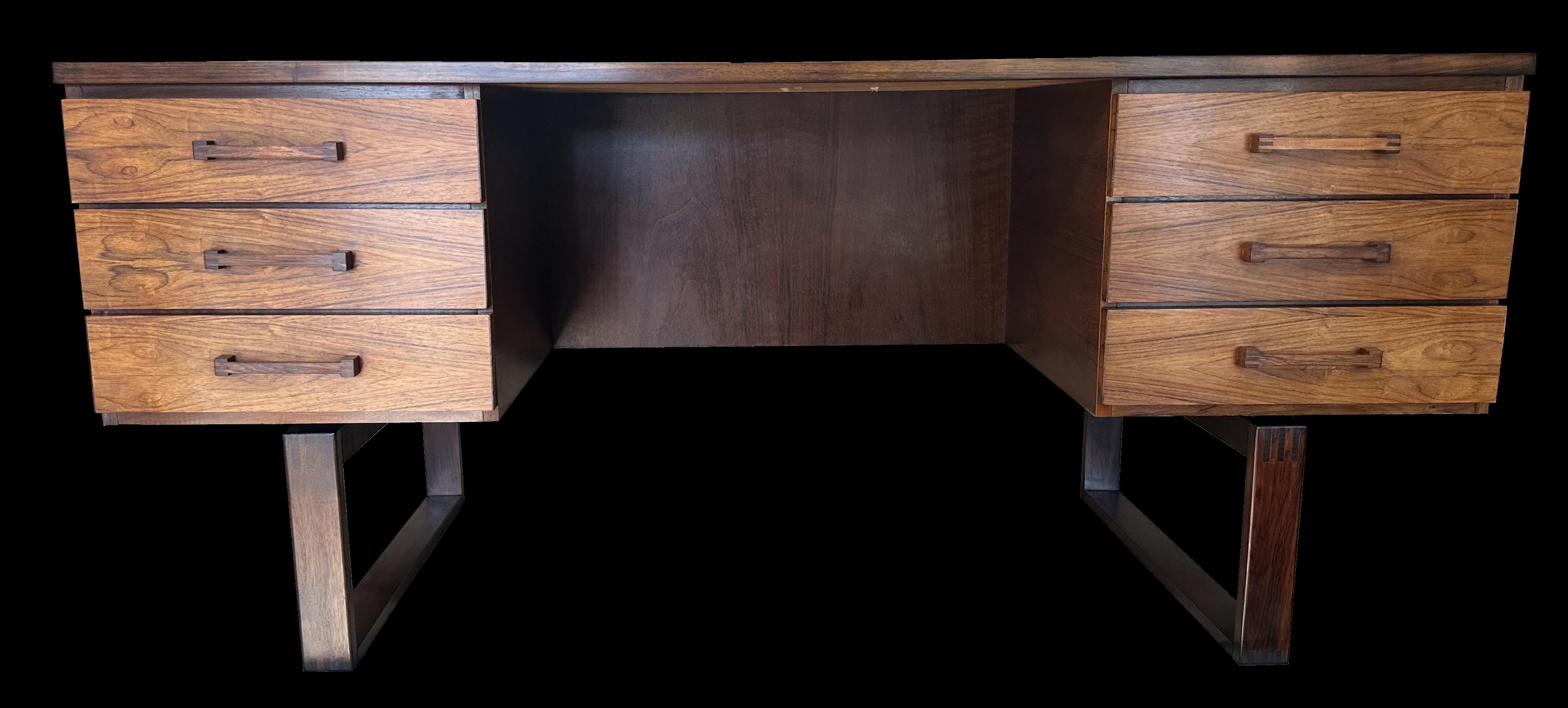 This model of desk by Valeur & Jensen rarely hang around for long and this one in particular has very nicely marked  grain. It is in fantastic condition, and ready for your home or work office. There are six equal sized drawers on one side, and an