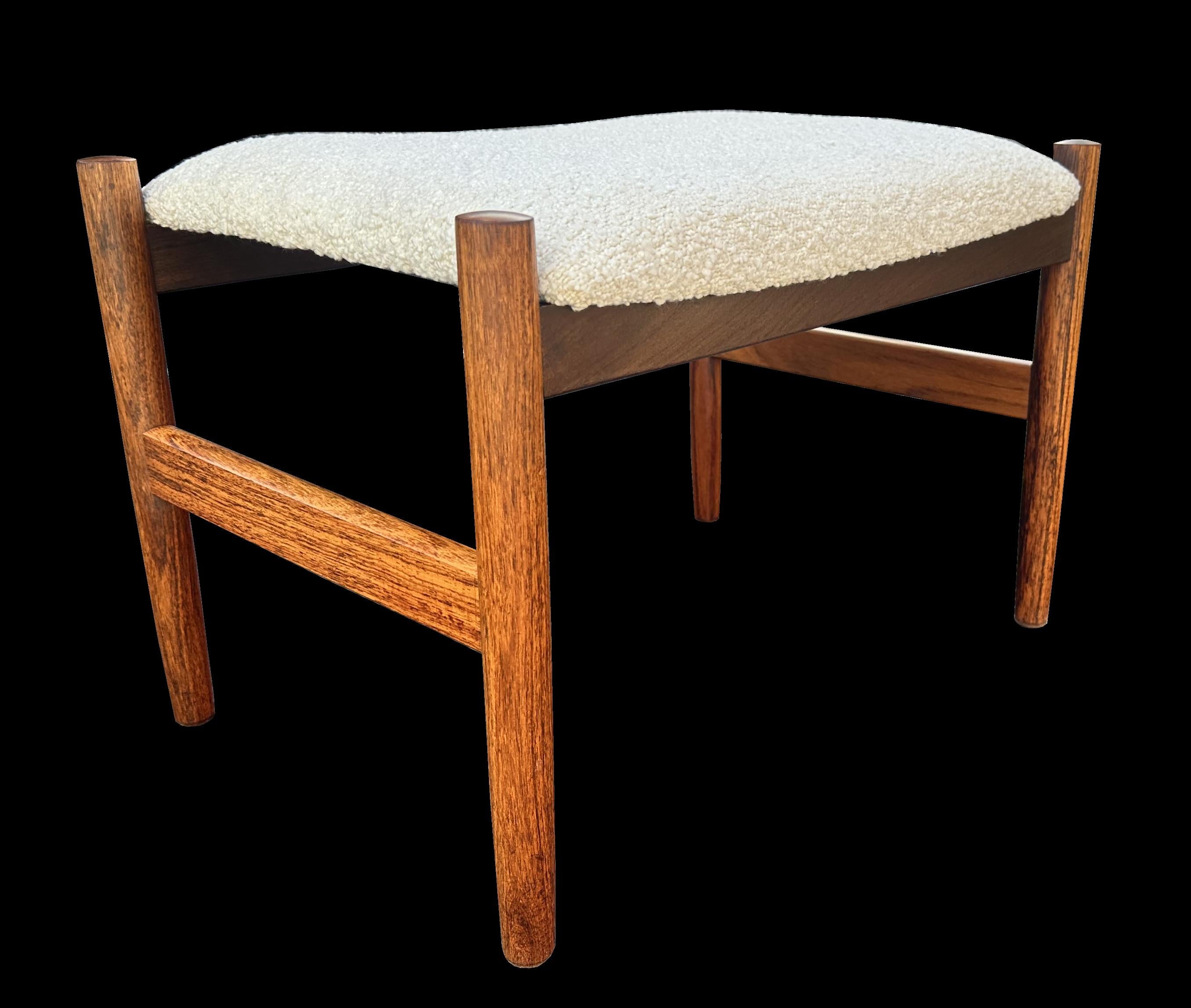 This is a very nice example, all original except for the fresh white boucle fabric upholstery. Made from Santos Rosewood or Machaerium Scleroxylon which is a sustainable species and therefore not on lists of endangered timbers and hence no problem