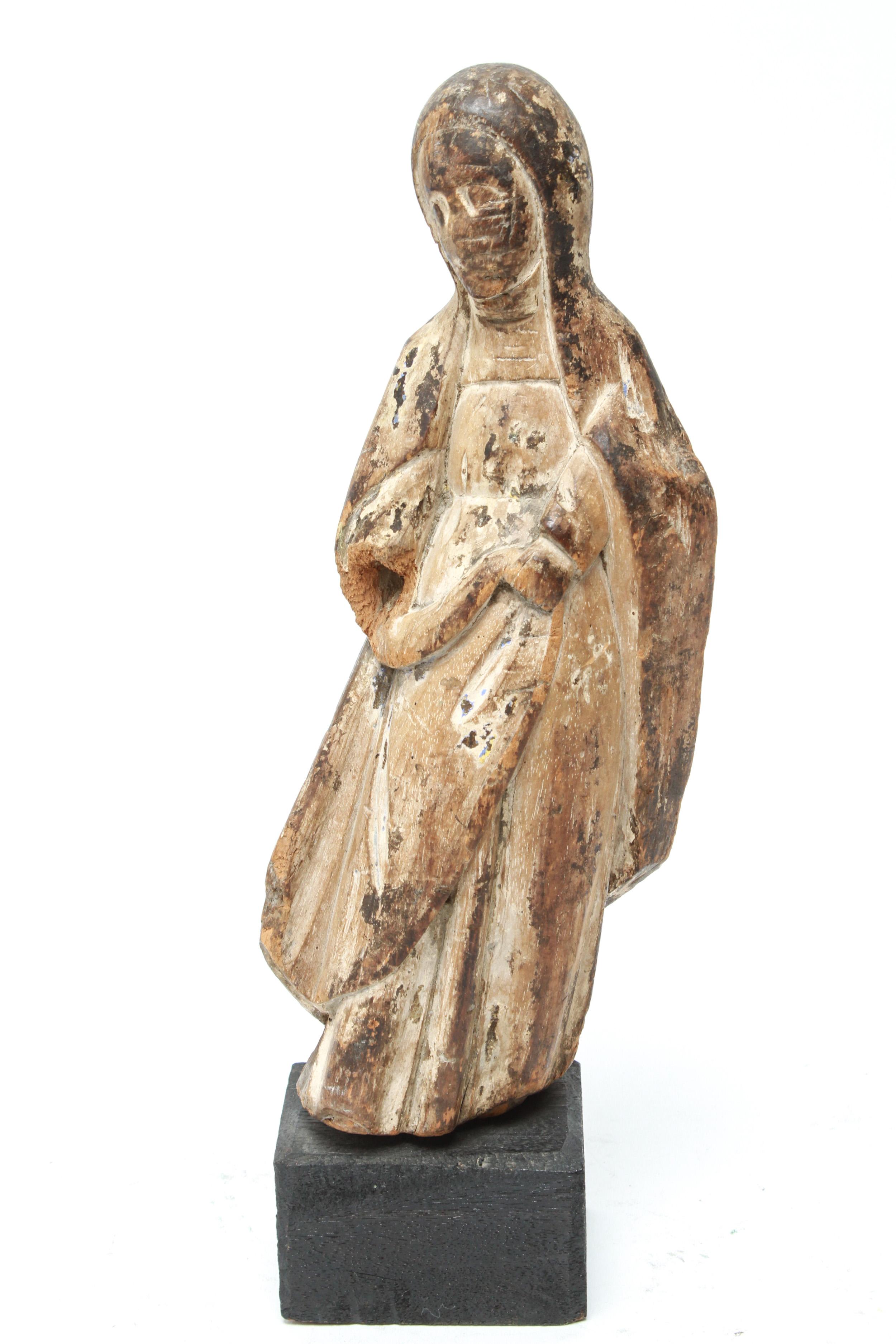 Santos Santa Maria carved wood sculpture with traces of paint, label on reverse: 
