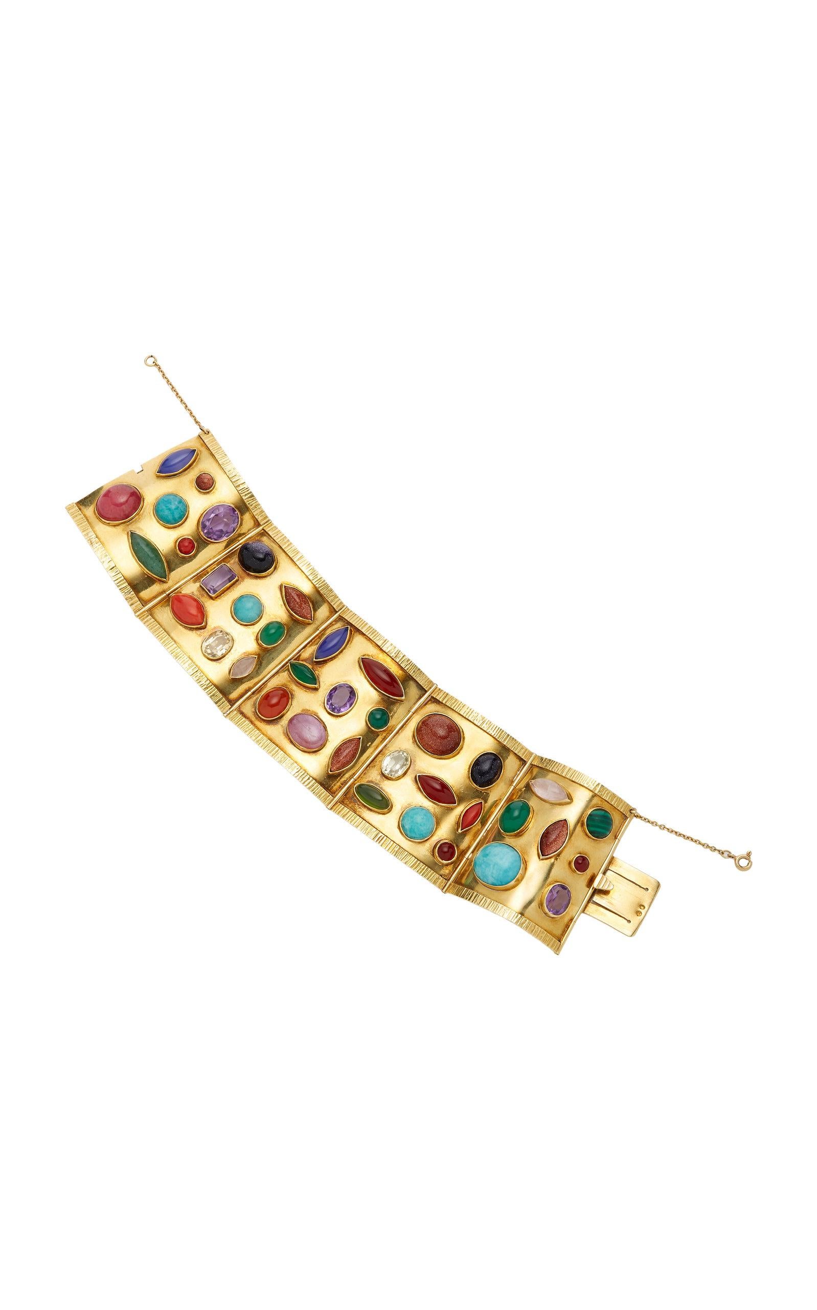 Sanz bracelet in 18kt yellow gold with oval, emerald-cut and fancy-shaped cabochon amethysts, yellow and colorless stones, goldstone, rhodochrosite, carnelian, malachite, chalcedony, coral and amazonite. Mad in Spain by esteemed jeweler Sanz, circa