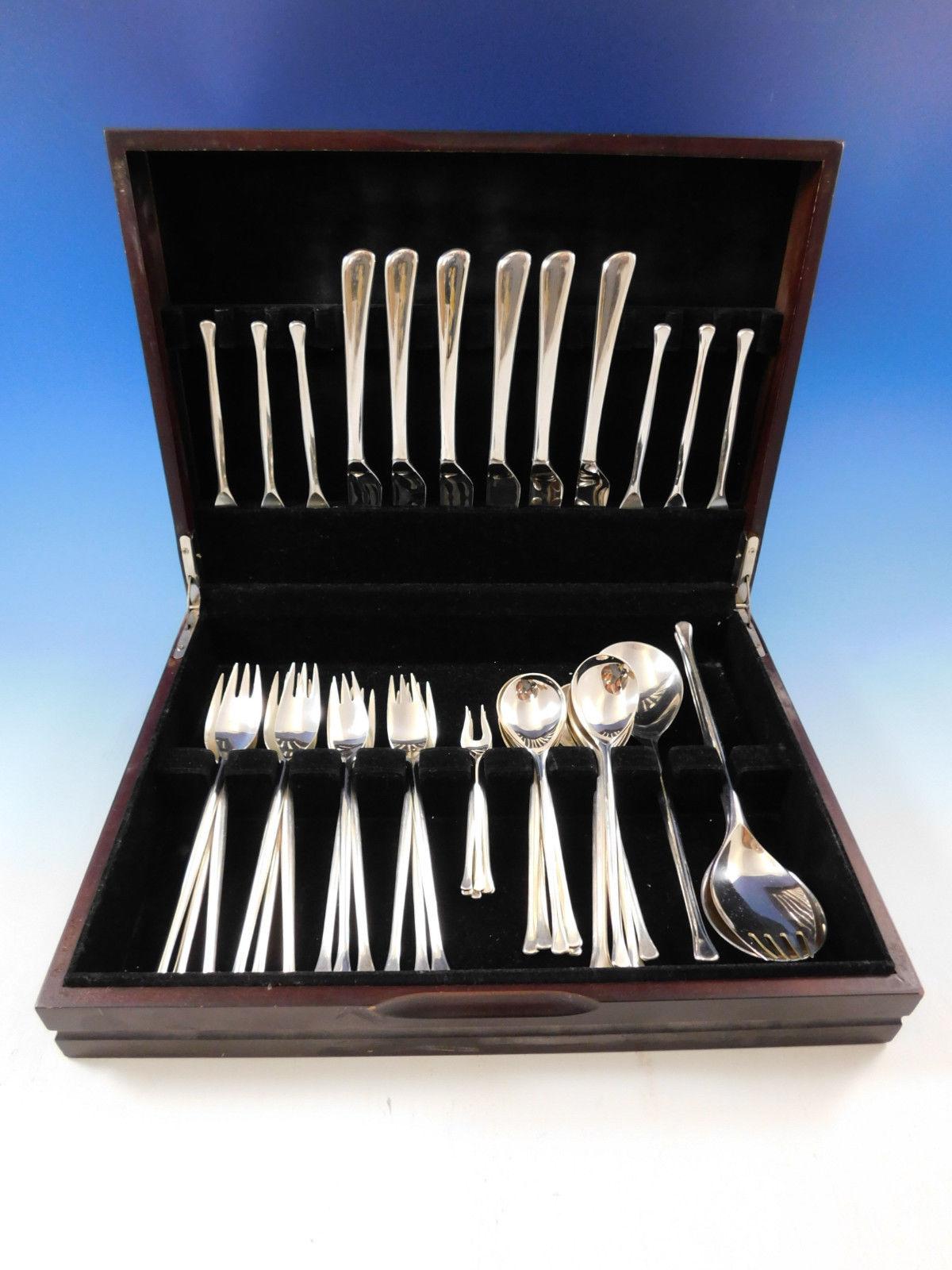 Rare Saphir by A. Michelsen Danish moderne sterling flatware set, 45 pieces. Functional design with smooth straight surfaces, their designs embraced the modernist movement and had the most minimal decoration in the form of grooves and streamlined