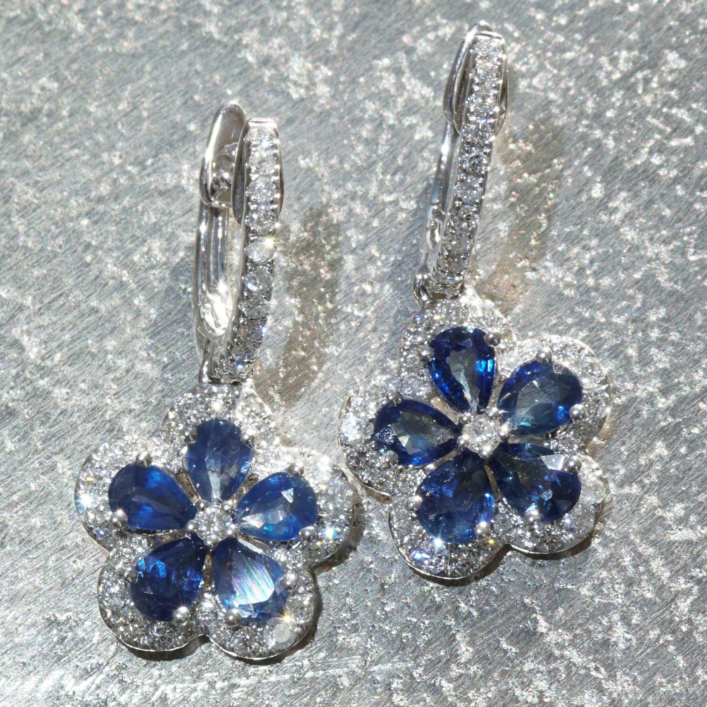 is there anything more beautiful than petals made of sapphire drops and a diamond as a flower stamp, here diamond creoles were combined with floral pendants classic modern and playful, sapphires total approx. 1.20 ct, beautiful sapphire color, 84