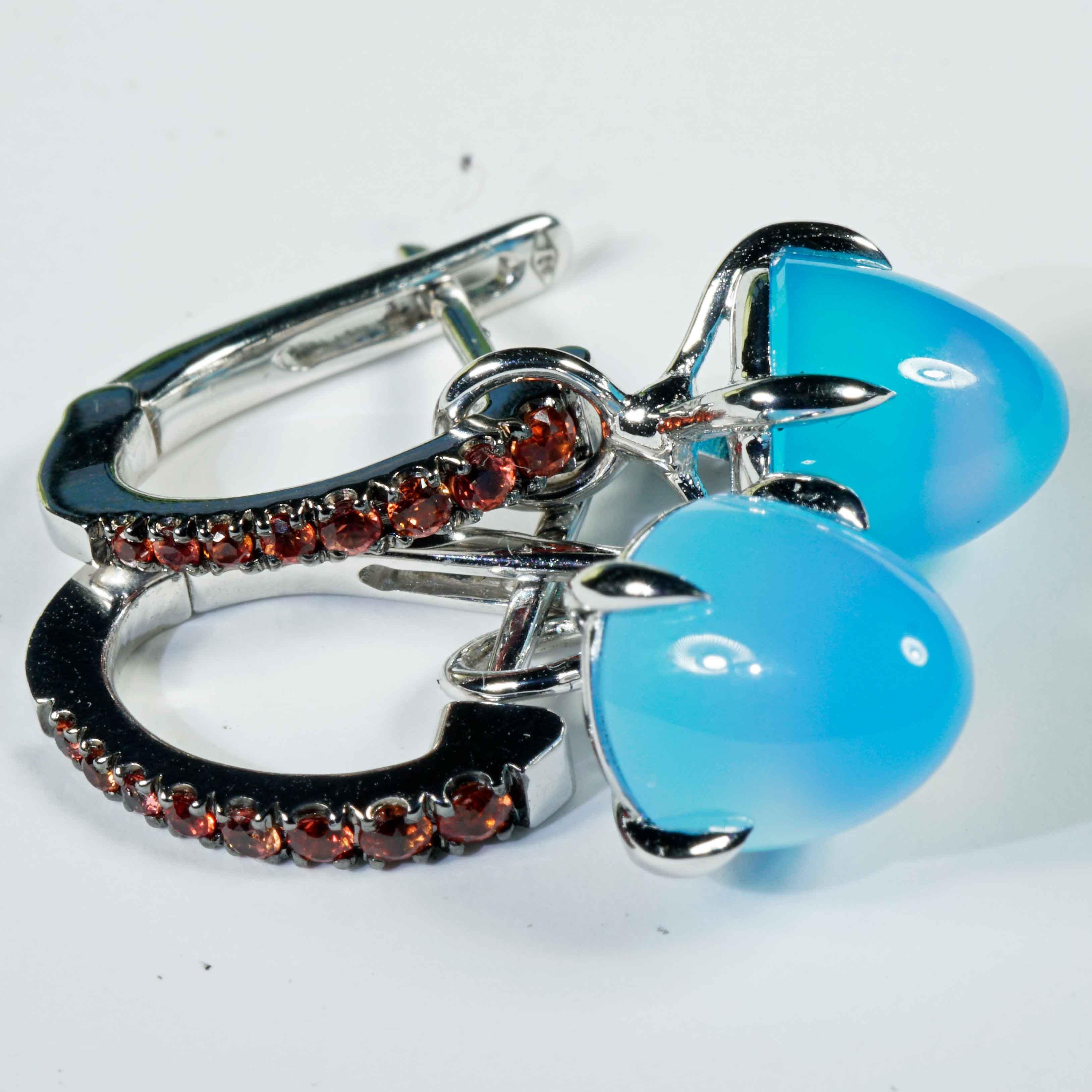 Earrings made in our traditional Italian goldsmiths in Valenza, delightful design, earrings with agate cabochon cones dyed in the color Paraiba blue, totaling approx. 5.90 ct with large hanging loop and modern setting with long crabs, for hanging,