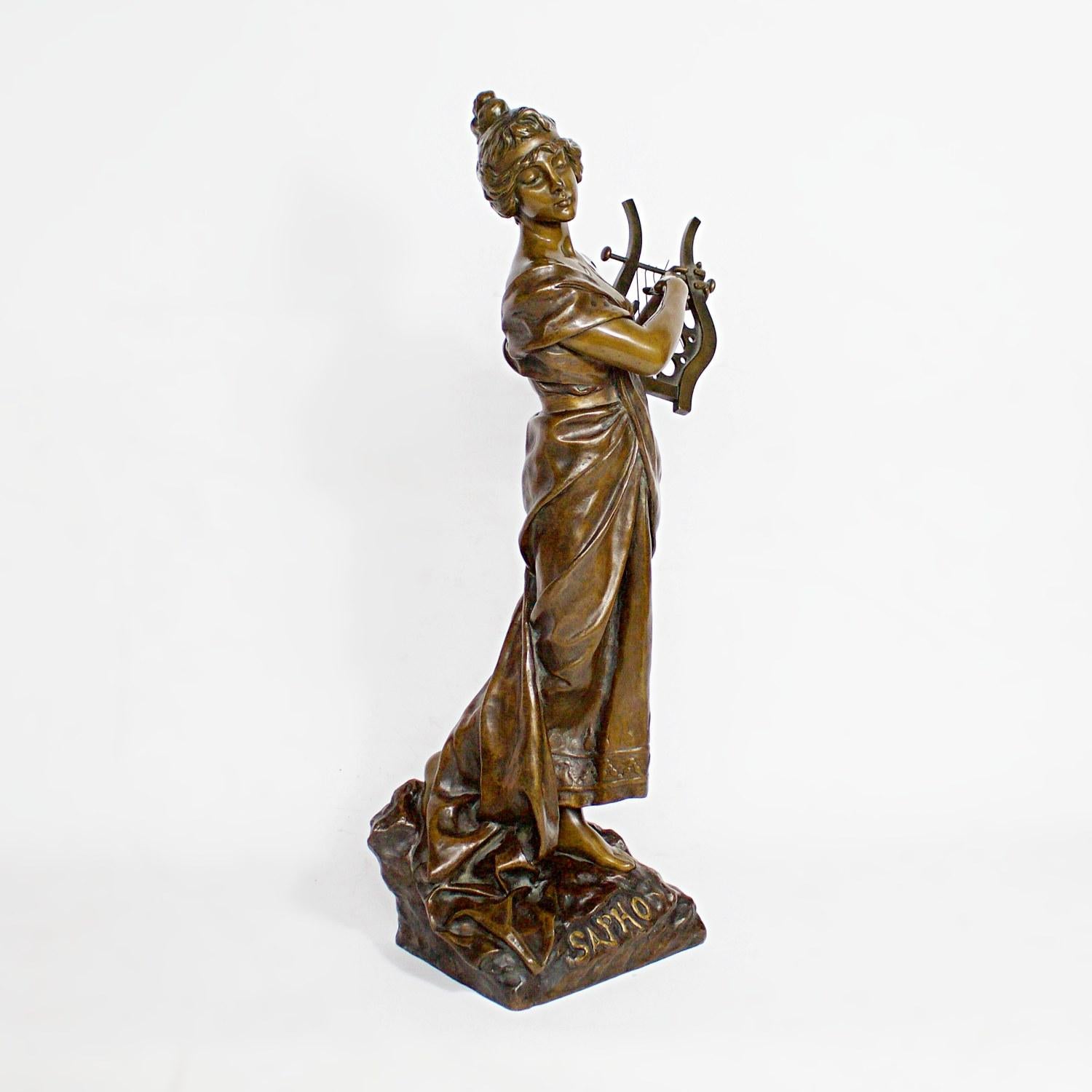 Sapho A large Art Nouveau sculpture by Emmanuel Villanis of Sapho playing her lyre, with her loose fitted garment falling at her feet. Labelled 'Sapho' and signed 'E'Villanis' to bronze. Numbered 5325 AP to back. 

Literature: Emmanuel Villanis by
