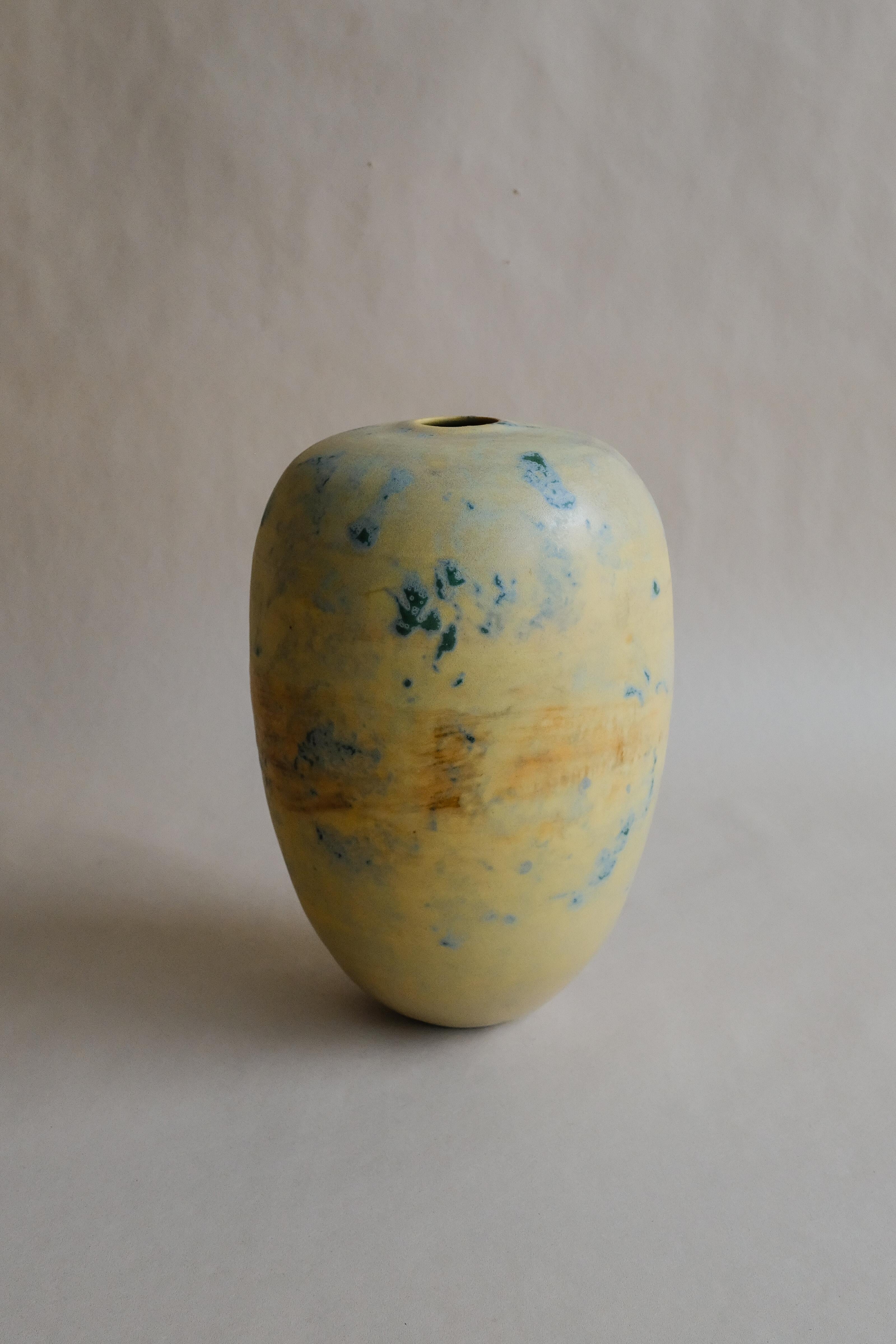 - Hand-thrown porcelain, featuring a proprietary, dimensional glaze fired in a high-fired gas kiln
- Organic rounded silhouette
- Form is inspired by the sapoche
- 1-inch opening
- Designed and made in NYC by Vy Voi
- Vy Voi designs are crafted