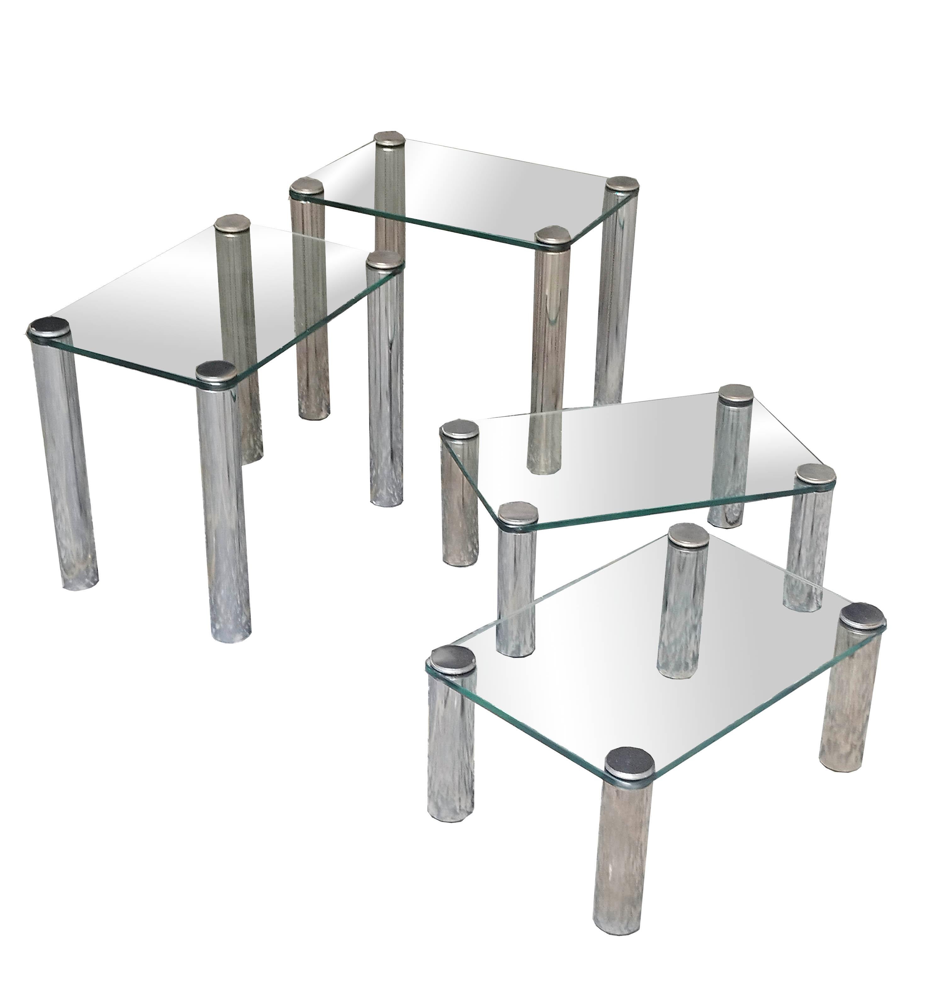 Saporiti stainless steel Etagere composed of four thick and solid glass coffee tables, which stacked one on top of the other form a small and original Etagere with an innovative fastening system between top and legs, suitable for any environment.