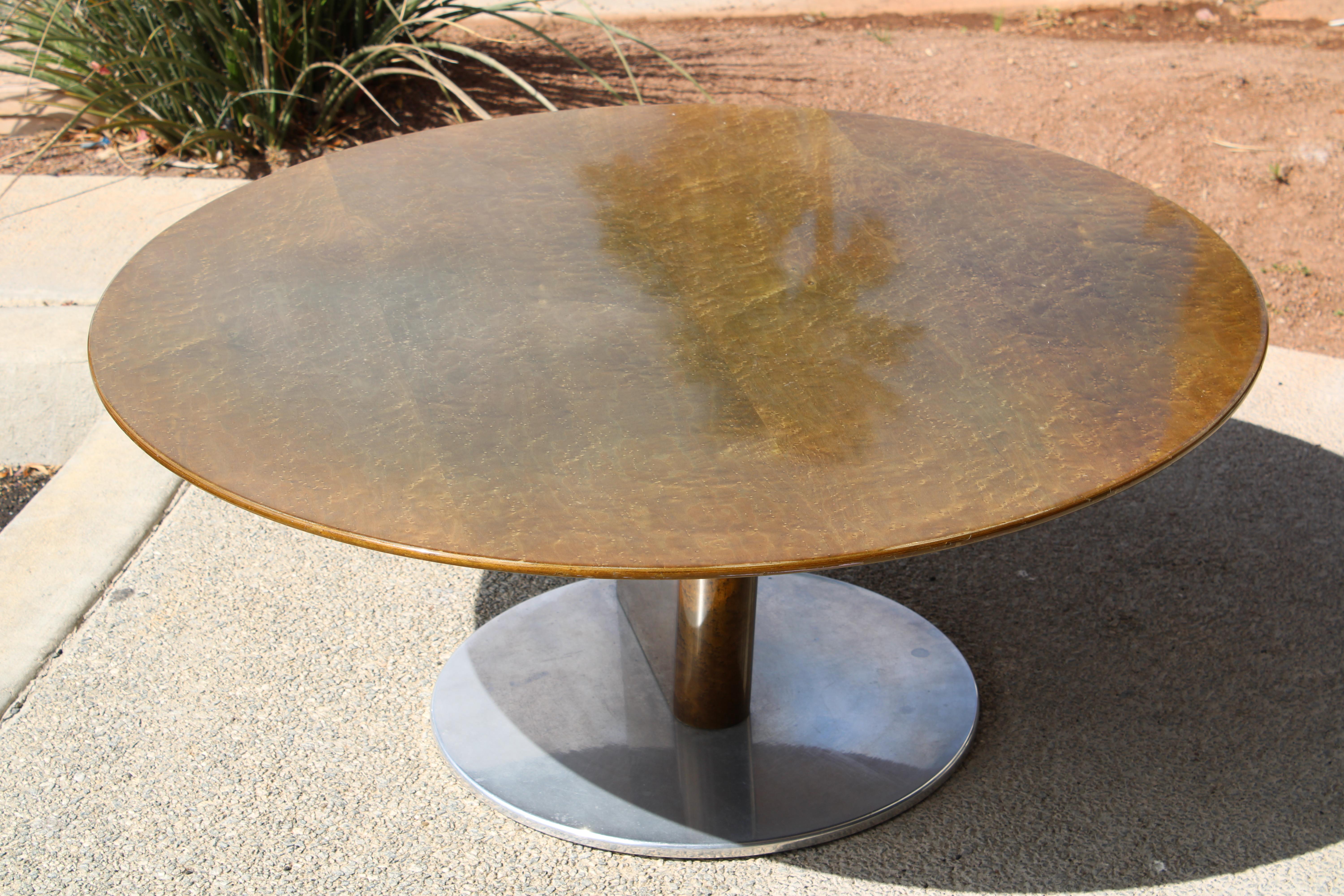 Italian coffee table with lacquered birdseye maple designed by Saporiti in the 1980's. Table is set above a circular aluminum base. We had the table top professionally lightly refinished to remove the scratches from years of use. Table measures