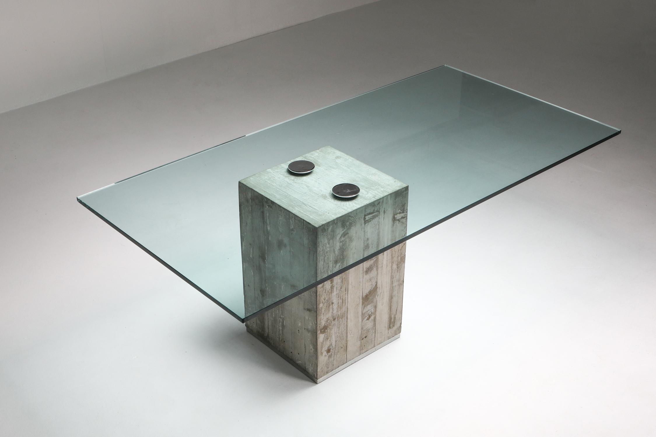 Brutalism, minimalism, concrete dining table, designed by Sergio and Giorgio Saporiti, for Saporiti, Italy, 1972.

model Sapo 
made of a solid concrete base with a hardened glass top attached to it with only 2 screws. 
Pure and simple minimalist