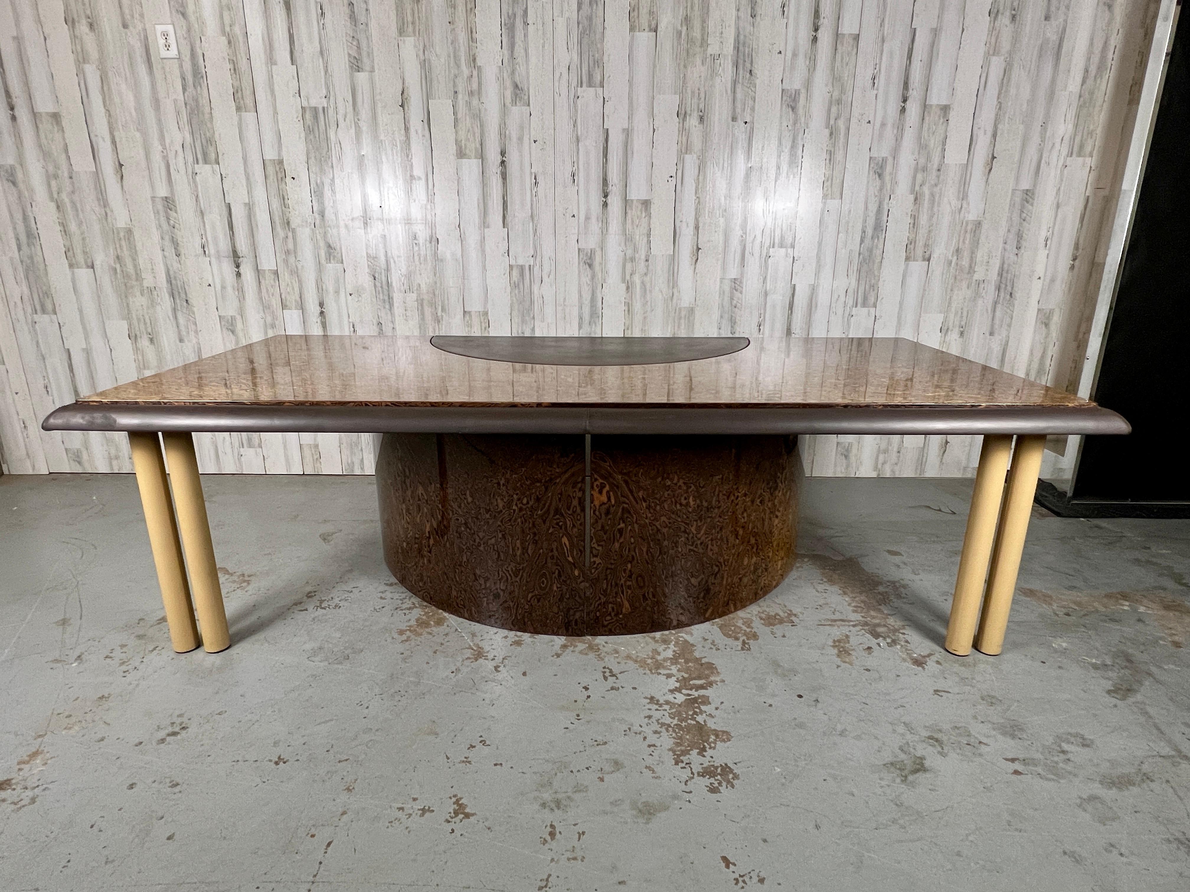 Saporiti Italia Exotic Burl wood & leather executive desk. A combination of straight and curved lines with Burl wood base and top accented with brown leather edge and work surface. Contrasting leather color on the legs make this a stunning