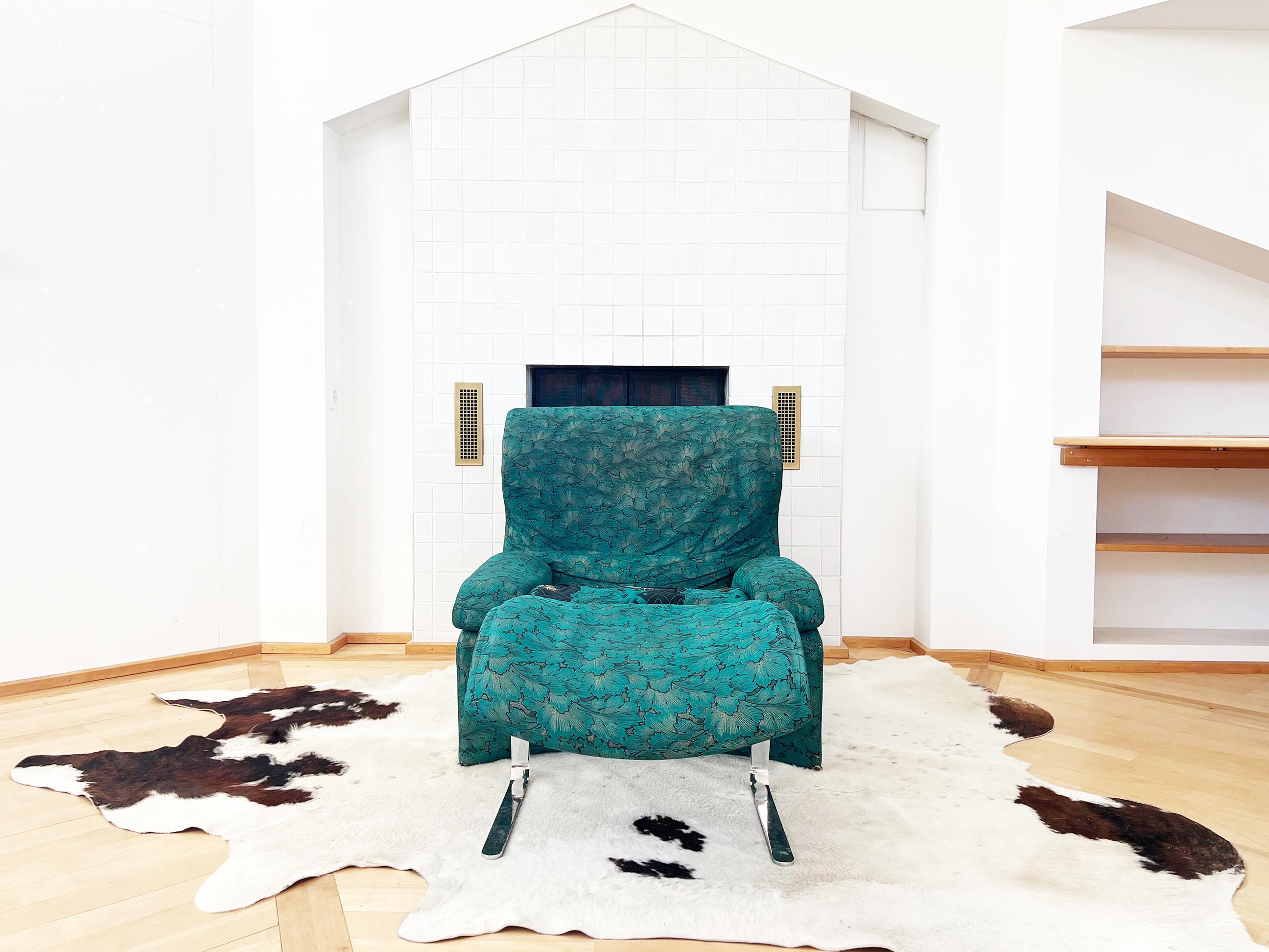 A stunning and exceptionally comfortable armchair and ottoman set with a gorgeous original golden sun designer textile (WOW) and a matching footstool that mirrors the armchair's curves. This set features its original upholstery in very good