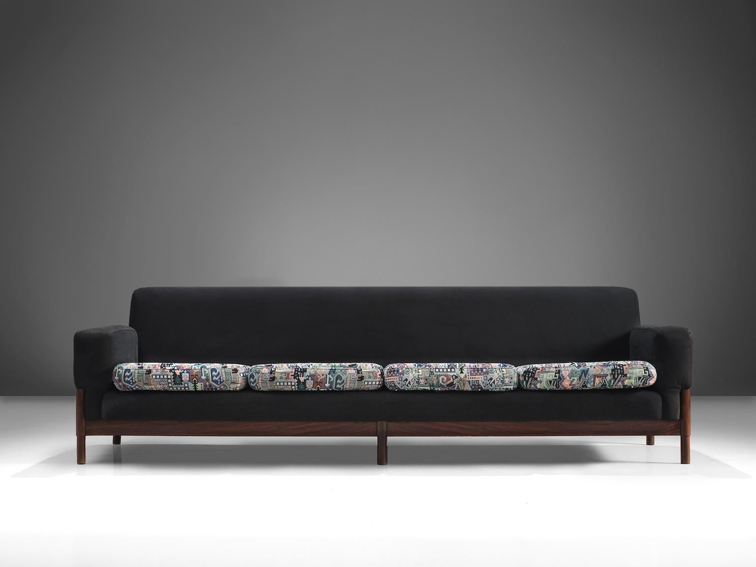 Saporiti, four seat sofa, rosewood, fabric, Italy, circa 1950.

This sofa is equipped with a rosewood frame and a graphic pattern on the seat and a black fabric on the rest of the chair. The sofa is designed in a modest, yet distinguished look. The