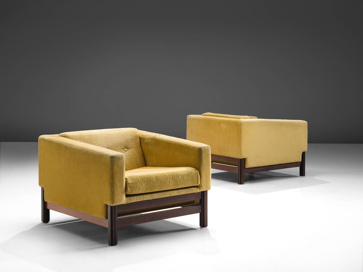 Saporiti, set of two club chairs in rosewood and yellow velvet fabric, Italy, 1960s.

These chairs, equipped with a rosewood frame still hold their original yellow upholstery. This chairs are designed in a modest, yet distinguished look. The chairs