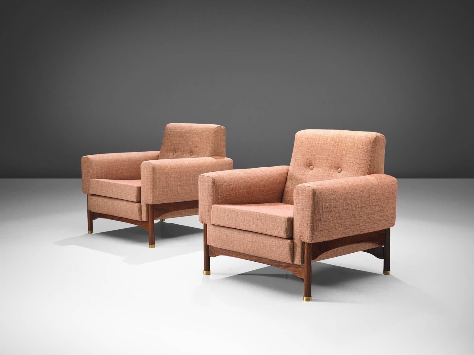 Pair of lounge chairs pink upholstery, rosewood, Italy, 1960s.

This elegant, geometric pair of lounge chairs feature a muted pink upholstery. The chairs stand on four little tapered wooden legs that support the seat. Eloquent detail is the slight