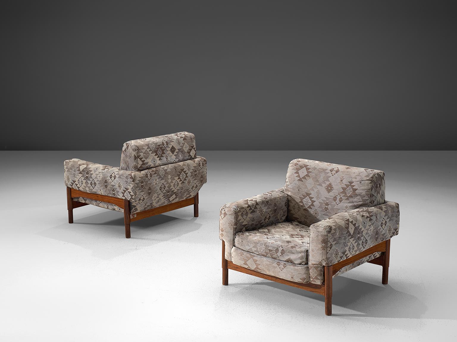 Saporiti, set of two lounge chairs in rosewood and fabric, Italy, 1960s.

These chairs are equipped with a rosewood frame and a retro sand to grey colored upholstery. These chairs are designed in a modest, yet distinguished look. The chairs