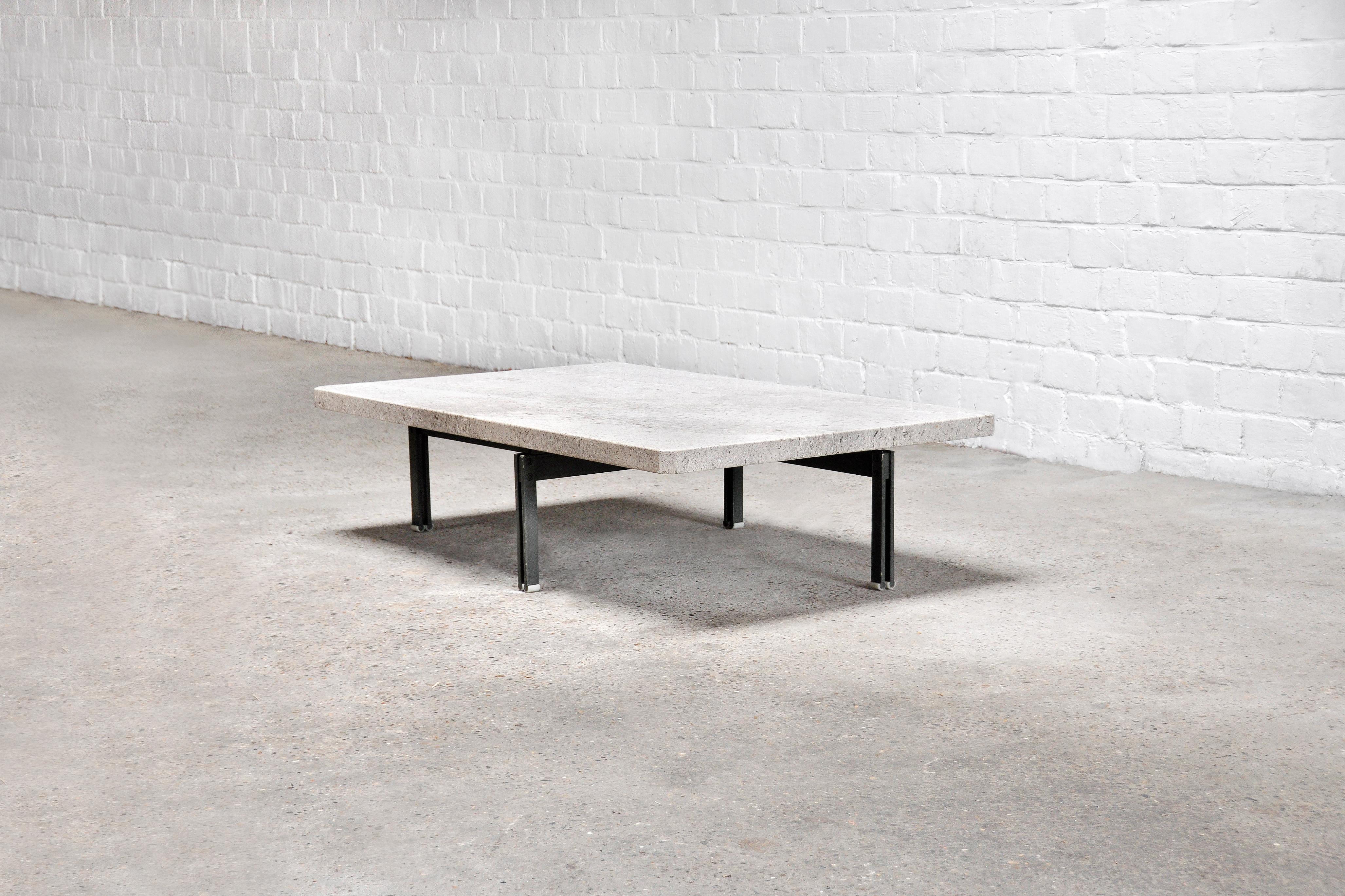 The 'Onda' coffee table was designed by Giovanni Offredi and manufactured by Saporiti in Italy in the 1970’s. This example features a dark brushed steel base and a light grey granite top. This original modernist design receives an