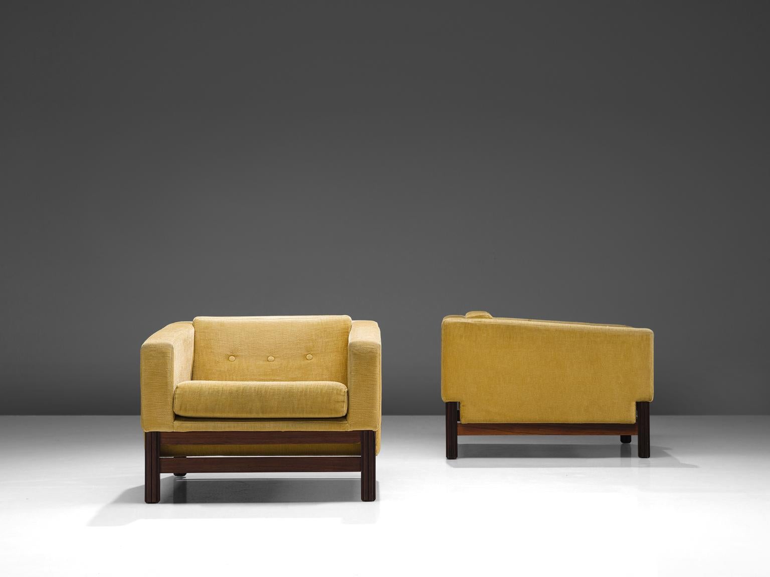 Saporiti, set of two club chairs in rosewood and yellow velvet fabric, Italy, 1960s.

These chairs, equipped with a rosewood frame still hold their original yellow upholstery. This chairs are designed in a modest, yet distinguished look. The