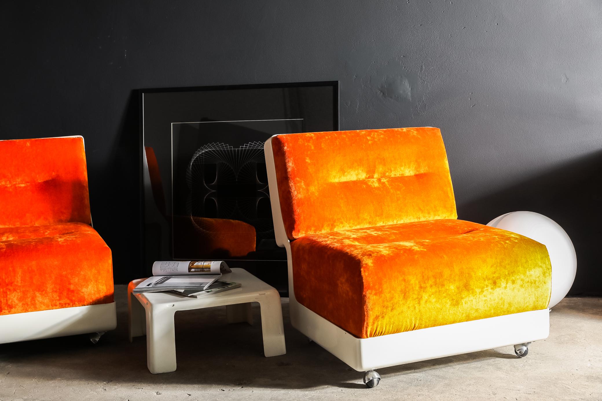 These super cool lounge chairs by Saporiti have been newly restored and upholstered in orange velour fabric. Designed by Vittorio Introini for Saporiti 1968. The frame is made from single molded fibreglass.