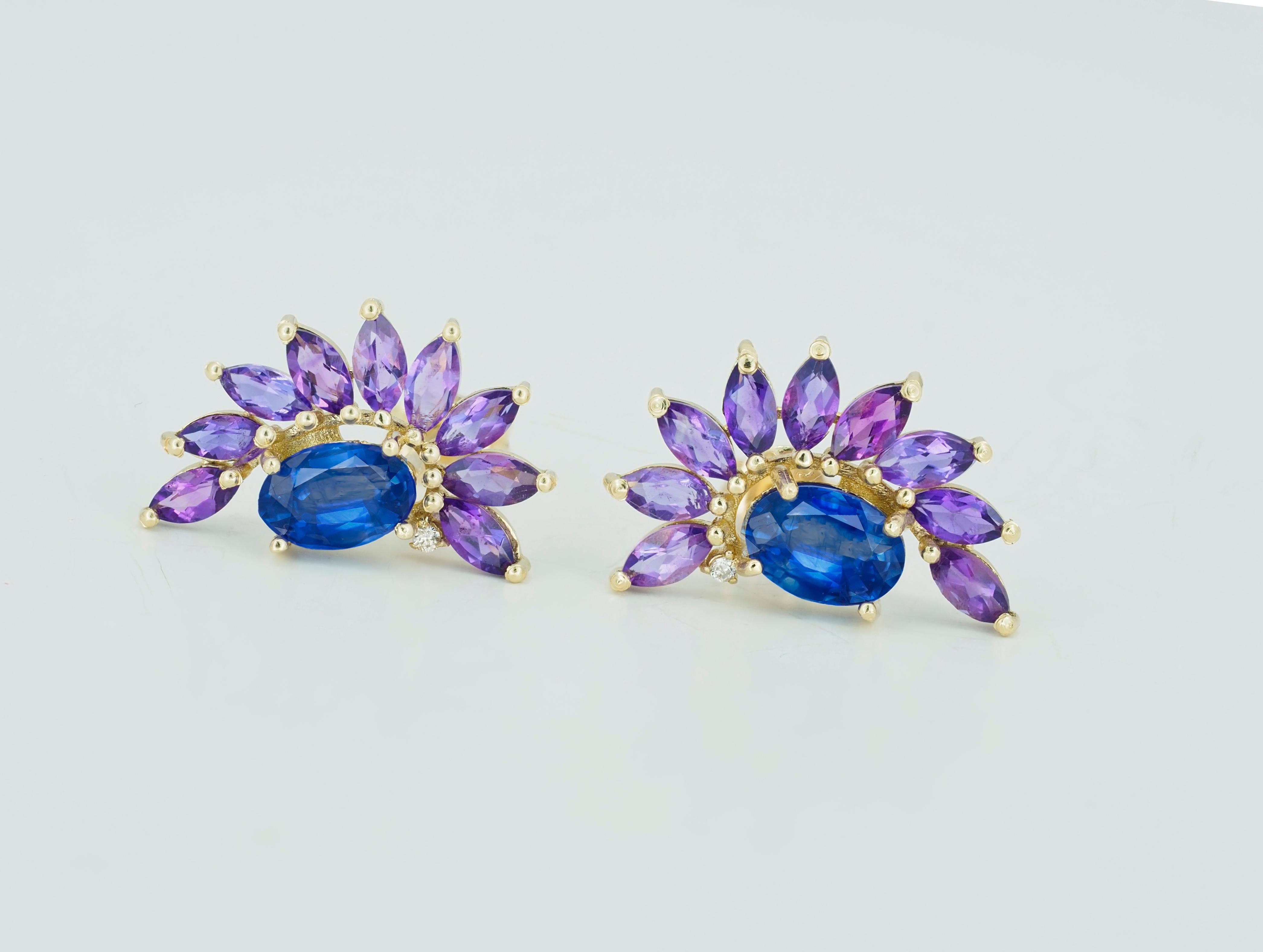 Sapphire 14k gold earrings studs. Amethyst earrings studs in 14k gold. Sapphire and amethyst in 14k gold earrings studs. 

Material: 14k gold.
Weight: 2.3 gr.
Size Earrings: 10x16.6mm
Central stones: Natural Sapphire - 2 pieces 
Cut: Oval
Weight: