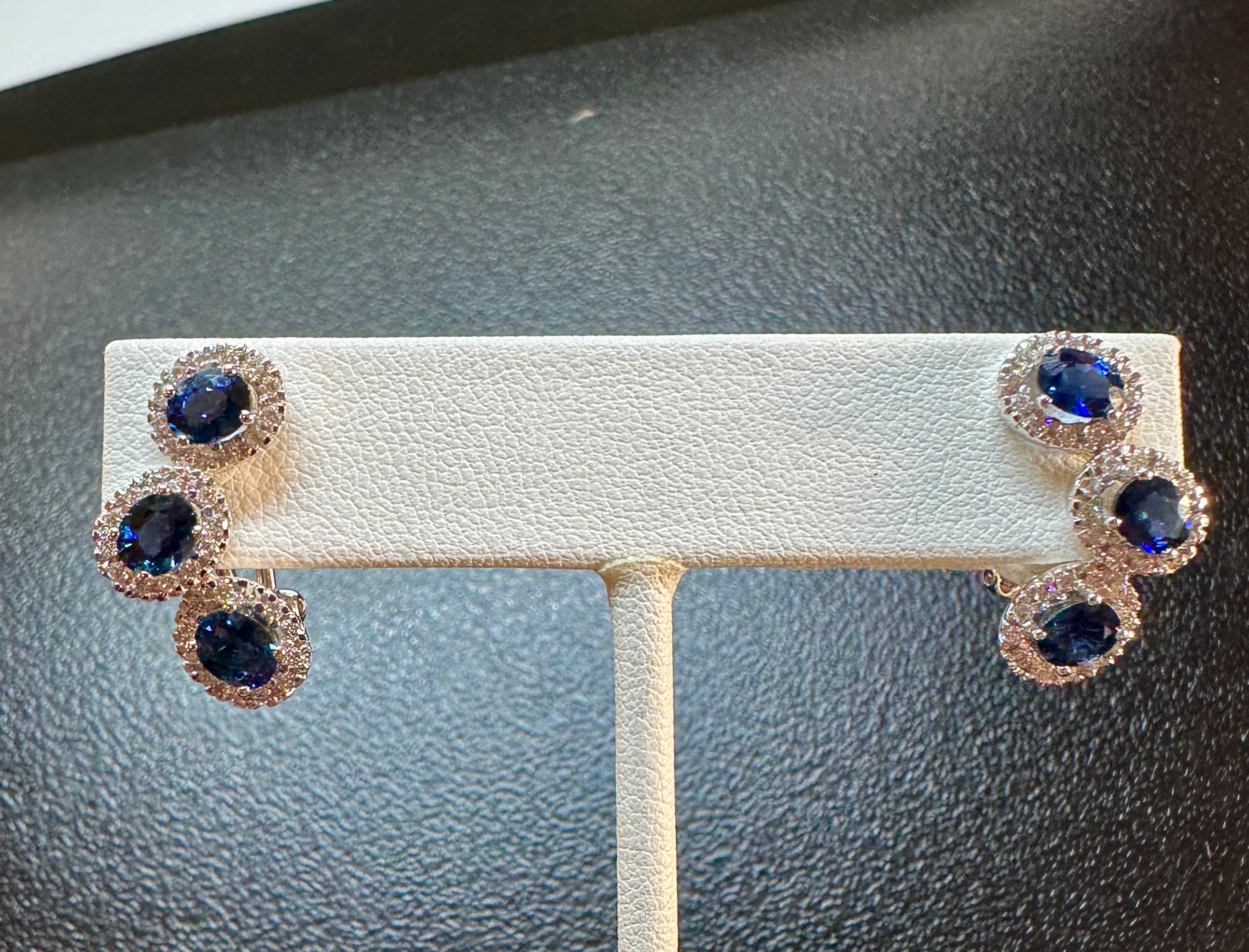 Indulge in a gorgeous pair of Two Carat Natural Mined Sapphire and 78 Natural Diamond Earrings in 18 Karat White Gold. The six fine blue natural sapphires are absolutely stunning oval faceted gems. They are each approximately 1/3 Carat in size. The