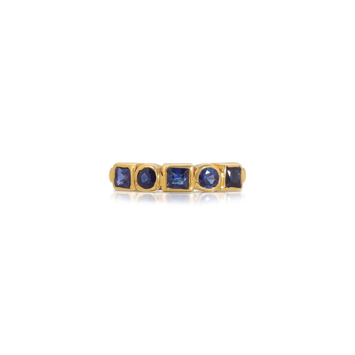 A beautiful signet ring of contemporary abacus design. This gorgeous ring features a melange of beautifully cut Blue Sapphires with a total Carat weight of 1.69 Carats. This ring is set in 22 Karat Gold overly Silver.