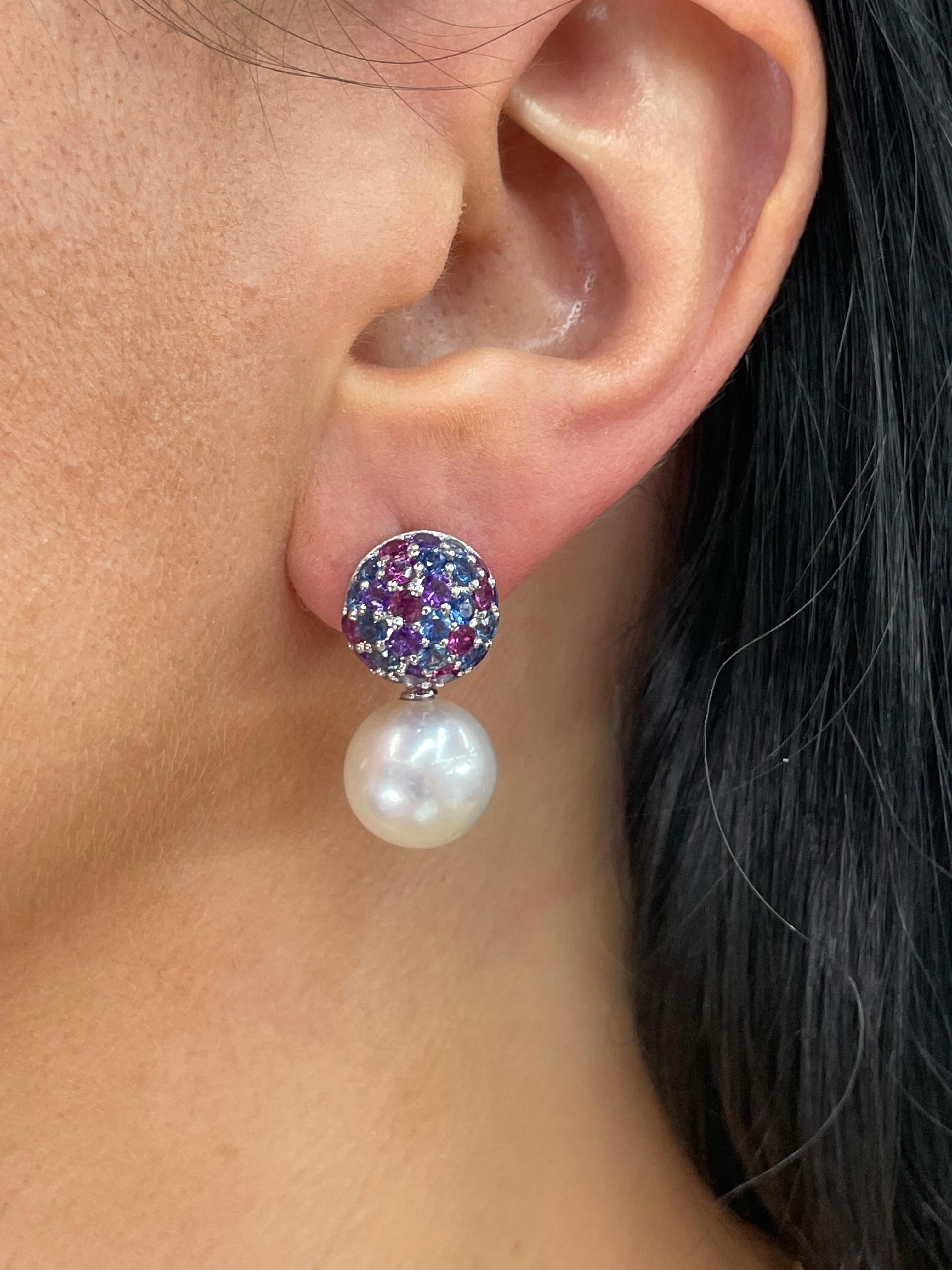 18 Karat White Gold dome drop earrings featuring number Sapphires, 2.20 Carats, Amethyst & Rhodolite weighing 2.80 Carats and two white South Sea Pearls measuring 12-13 MM.

Customize in Golden, Pink Freshwater or Tahitian
DM for more price & more