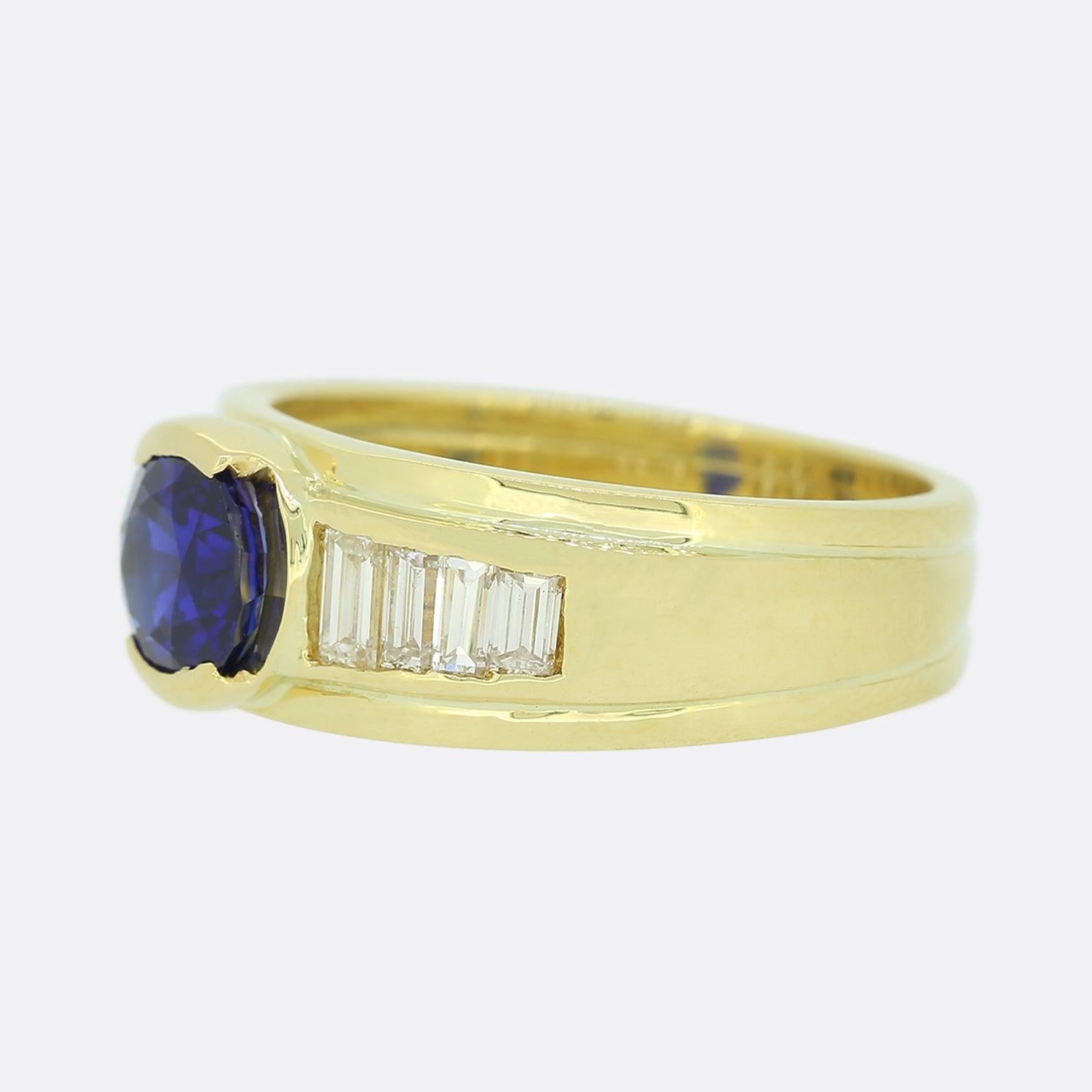 This is a modern 18ct yellow gold gypsy style ring. The ring is set with a central brilliant cut sapphire with graduated baguette cut diamonds on each shoulder. 

Condition: Used (Very Good)
Weight: 6.9 grams
Size: L
Band Width: 5mm - 7mm
Sapphire: