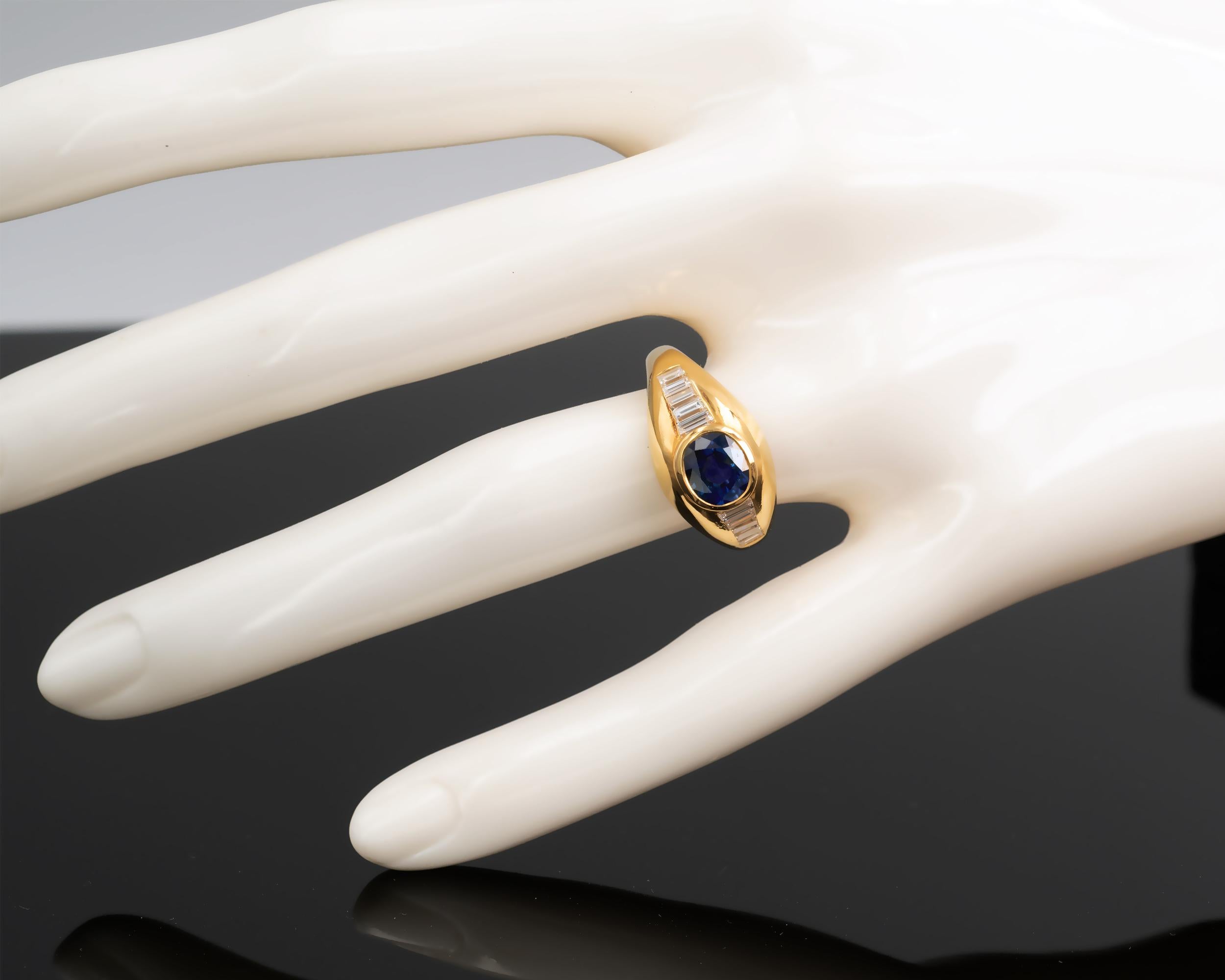 Oval Cut Sapphire and Baguette Cut Diamonds 18Kt Gold Ring For Sale