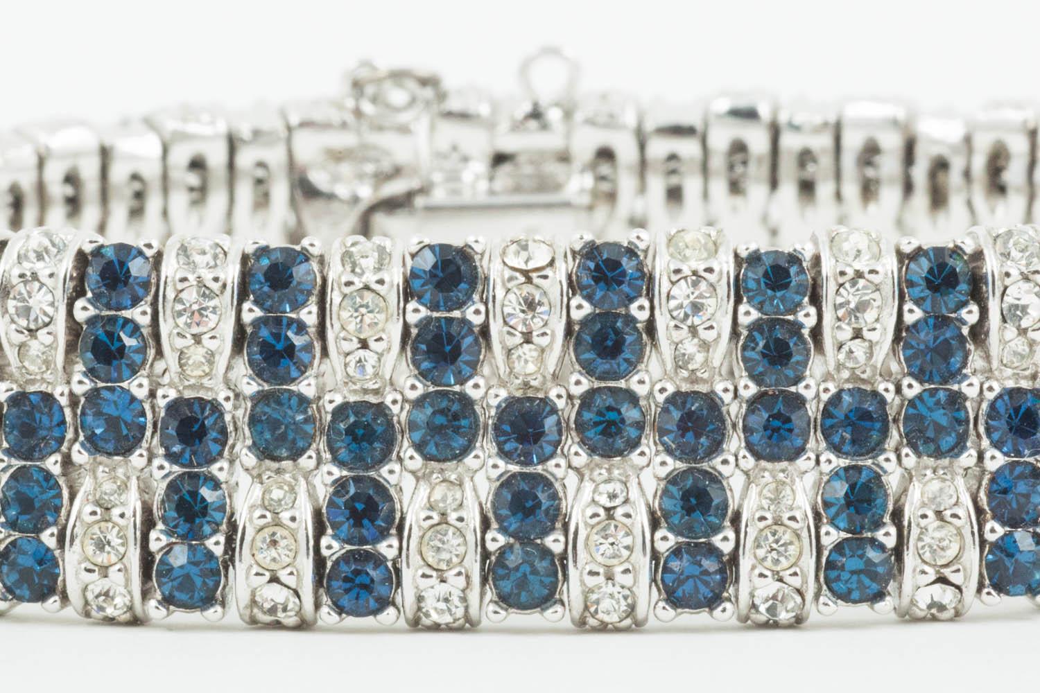 A beautifully articulated paste bracelet from Ciner, with alternating panels of sapphire and clear paste, unified by a single row of sapphire pastes running through the centre of the bracelet. Exquisitely made and of the highest quality, as always