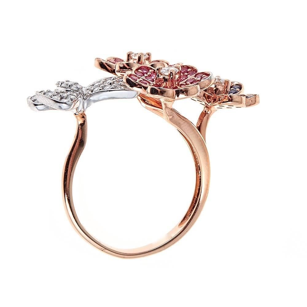 Beautiful ring with butterfly and flowers made in 14k yellow gold is all accented with approximately 1.12 CT in pink and blue sapphires and approximately .61 CT in diamonds.