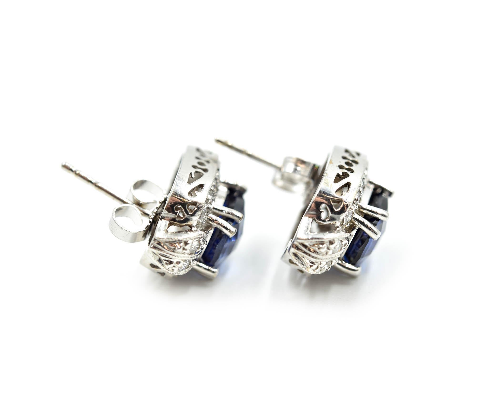 Designer: custom design
Material: 14k white gold
Sapphires: 2 oval sapphires = 4.58 carat total weight
Diamonds: 32 round brilliants = 0.32 carat total weight
Dimensions: earrings measure 15.58mm x 10.05mm
Fastenings: friction backs 
Weight: 4.86