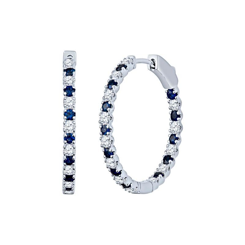 These elegant endless hoop earrings showcase a captivating combination of natural round diamonds and sapphires, totaling 2.08 carats in a delightful design. Crafted from high-quality 14 karat white gold, they add a touch of sophistication to any