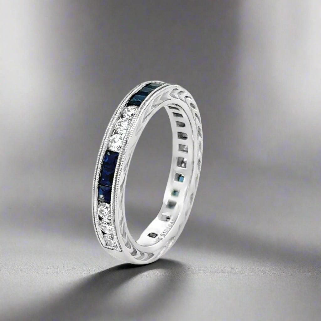 Expertly crafted and elegant, our Sapphire and Diamond 14k White Gold Band/Ring features intricate engraved detail on the top and bottom, a delicate milgrain edge, and sparkling, vibrant gemstones. Perfect for any occasion, this stunning ring is
