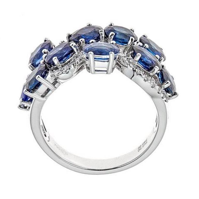 Oval Shaped Blue Sapphire 0.27 ct Diamond Wedding Band Ring in 18 kt White Gold

The intriguing design featured in this ring will only make her day brighter. Fashioned with oval cut deep blue sapphires, interlinked with smaller round diamonds. this