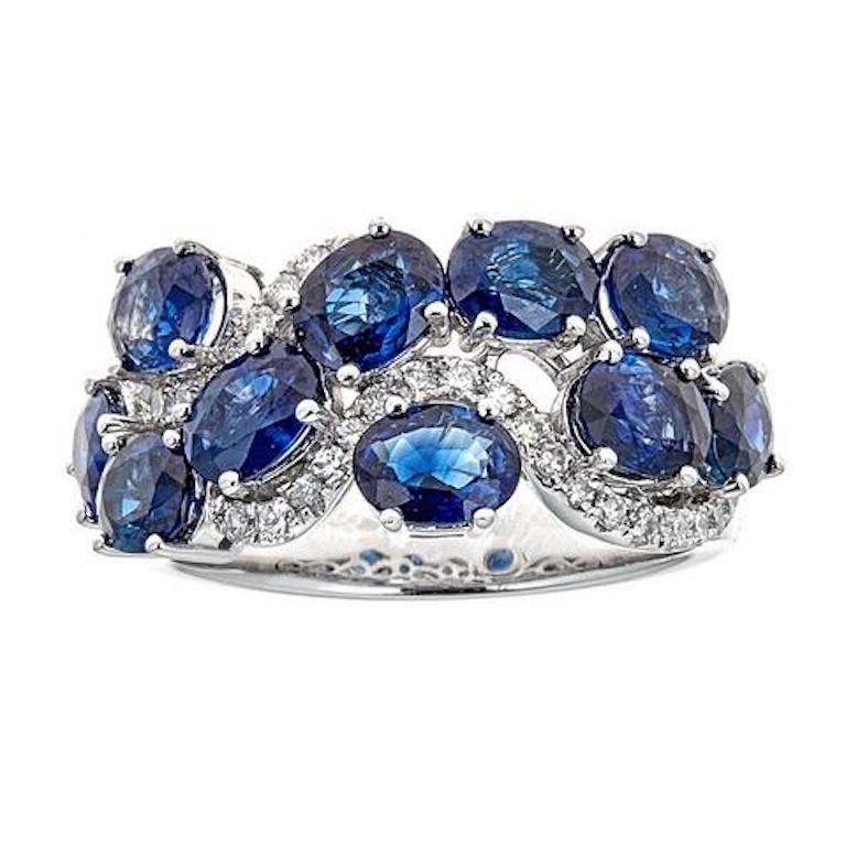 Alliance en or blanc 18 carats avec saphir bleu de taille ovale et diamant de 0,27 carat en vente