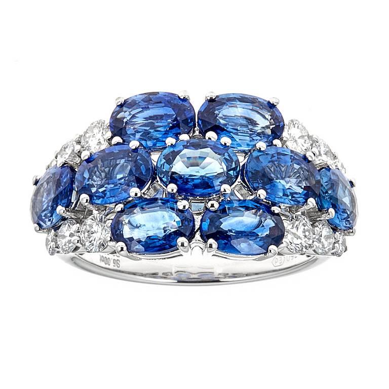 Oval Cut Blue Sapphire and Diamond Accent Floral Ring in 18 karat White Gold